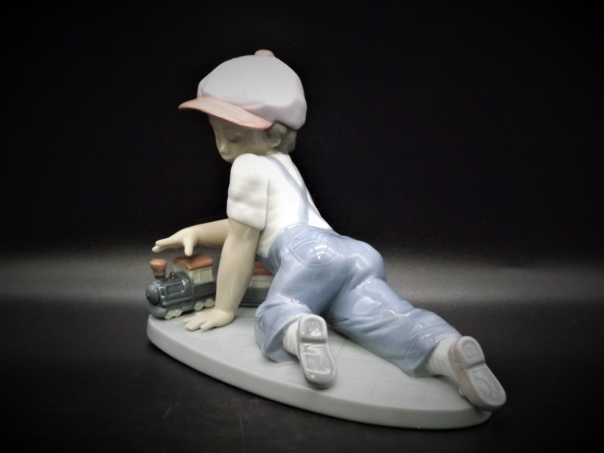 Vintage Lladro "All Aboard" #7619 with original box. Young Boy playing with his trains. Completely intact! Excellent condition!