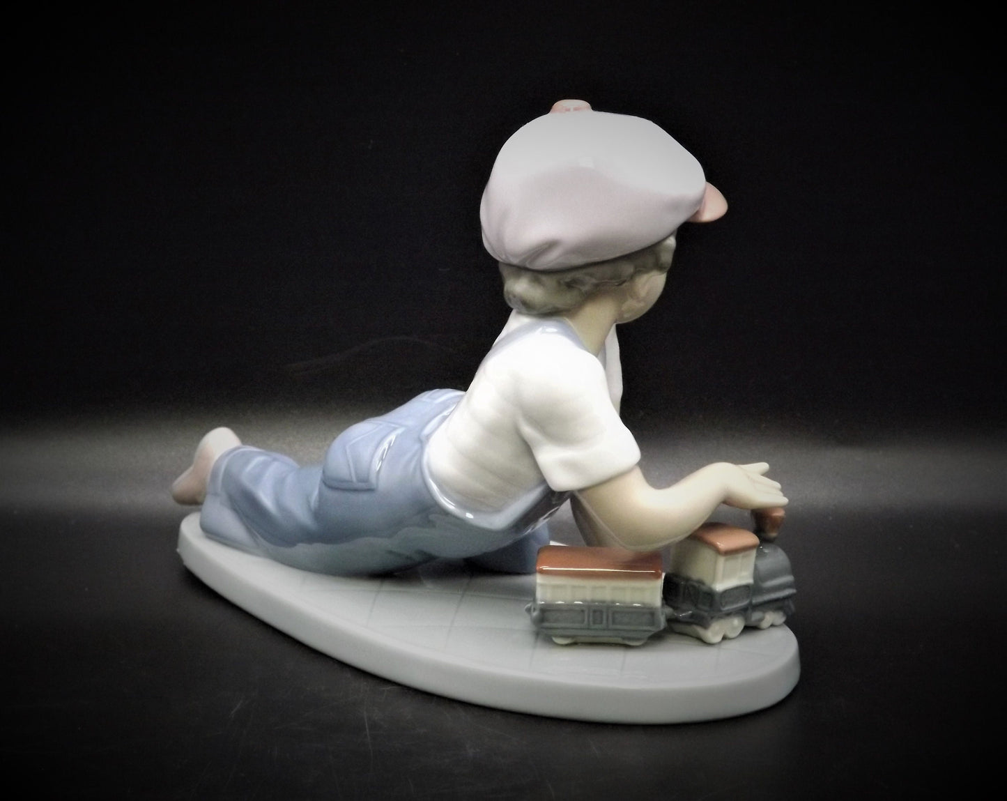 Vintage Lladro "All Aboard" #7619 with original box. Young Boy playing with his trains. Completely intact! Excellent condition!