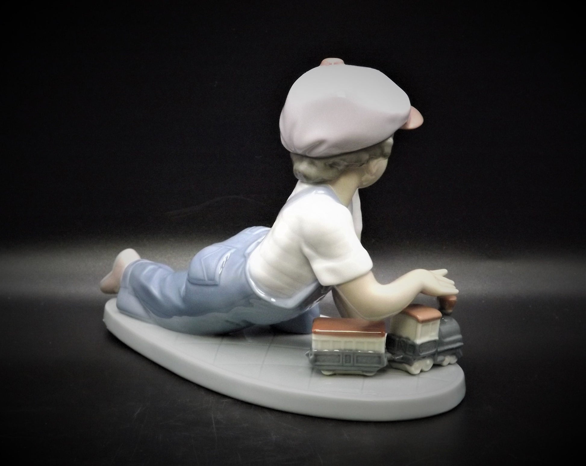 Vintage Lladro "All Aboard" #7619 with original box. Young Boy playing with his trains. Completely intact! Excellent condition!