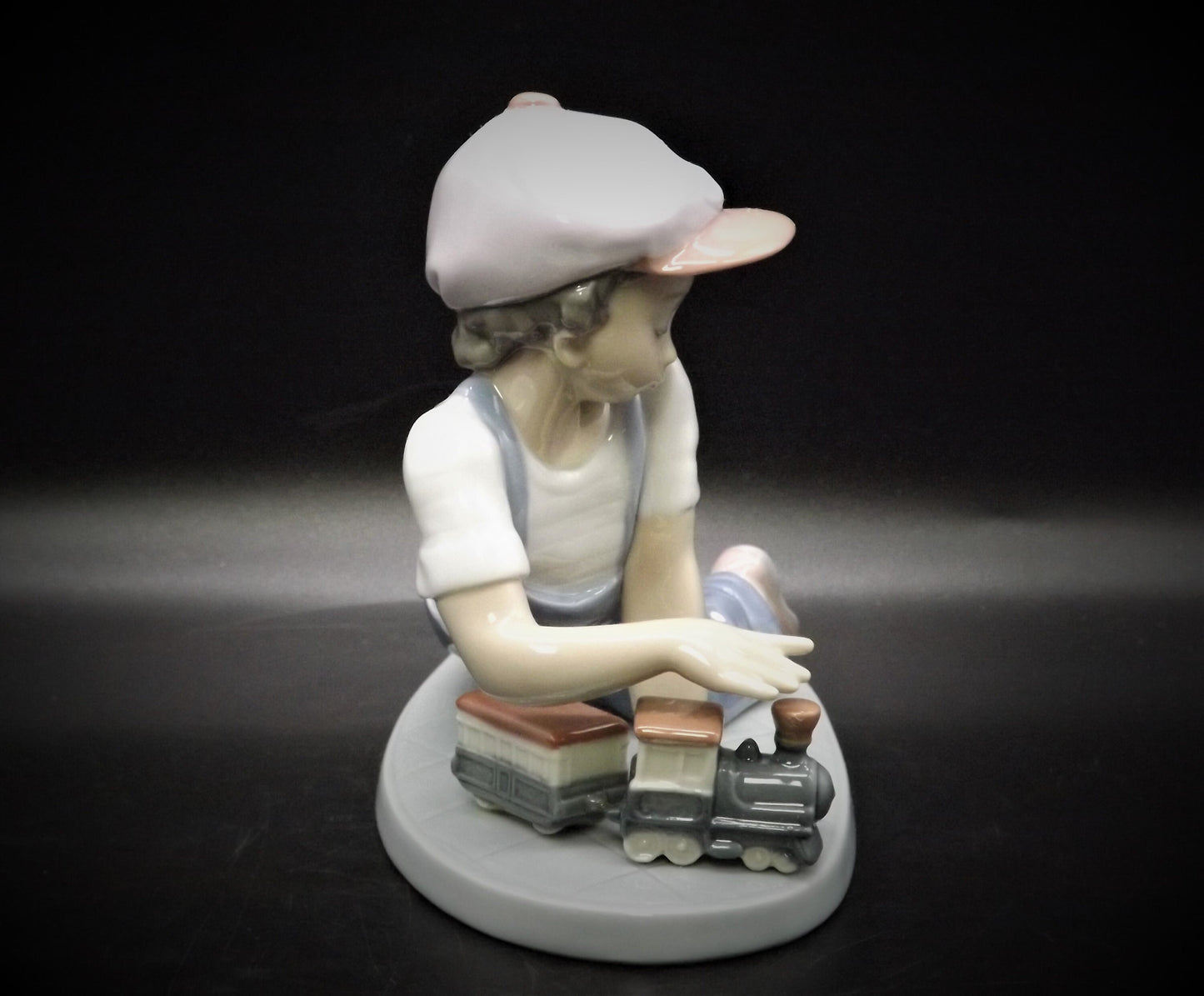 Vintage Lladro "All Aboard" #7619 with original box. Young Boy playing with his trains. Completely intact! Excellent condition!