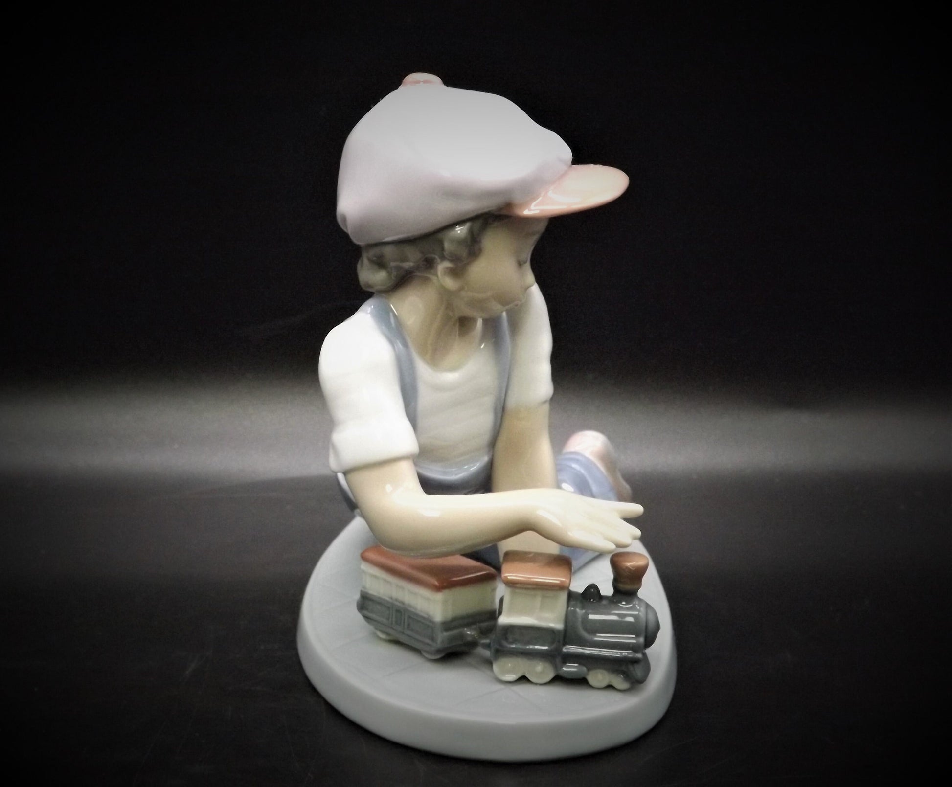 Vintage Lladro "All Aboard" #7619 with original box. Young Boy playing with his trains. Completely intact! Excellent condition!