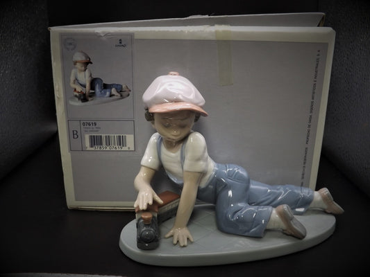 Vintage Lladro "All Aboard" #7619 with original box. Young Boy playing with his trains. Completely intact! Excellent condition!