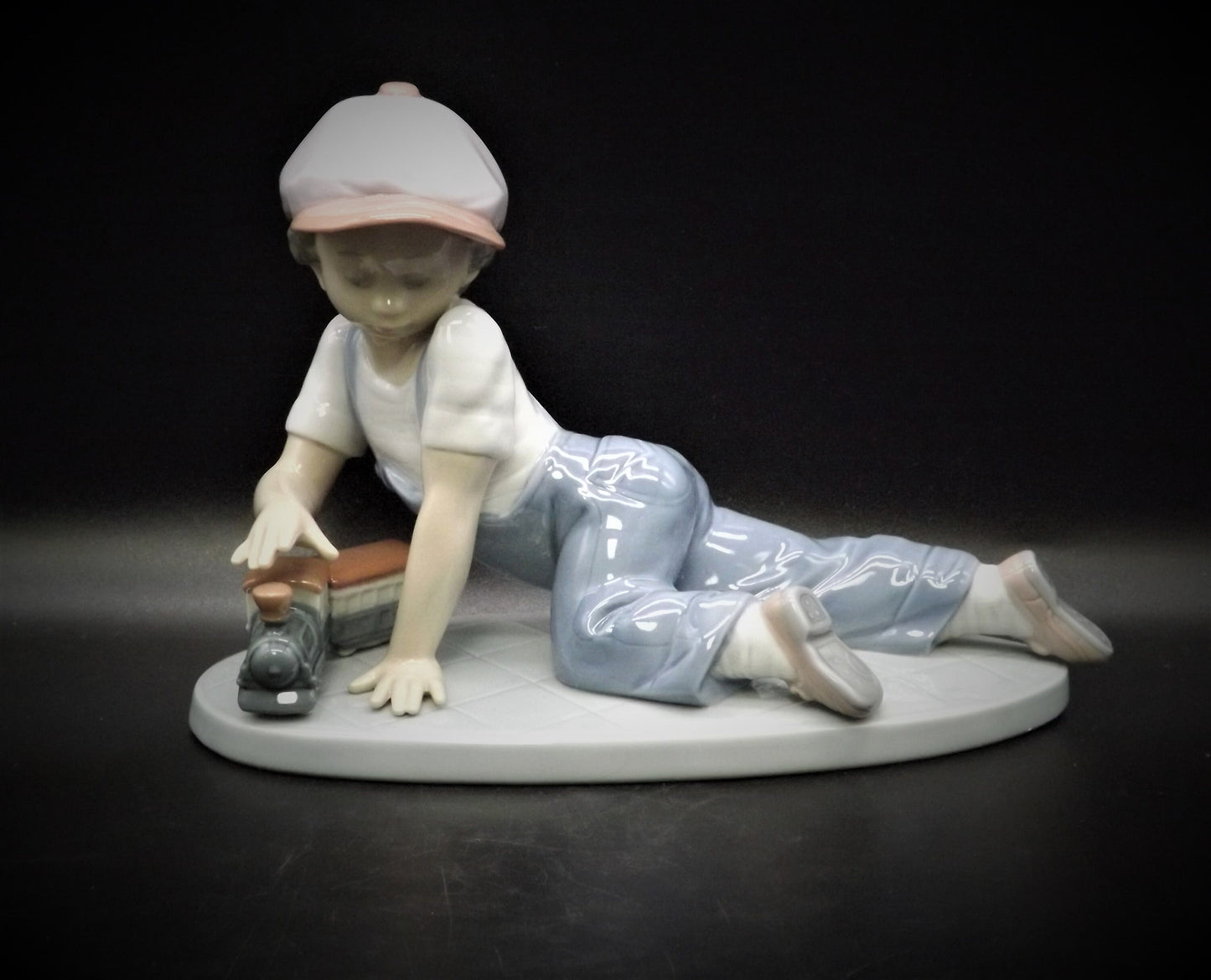 Vintage Lladro "All Aboard" #7619 with original box. Young Boy playing with his trains. Completely intact! Excellent condition!