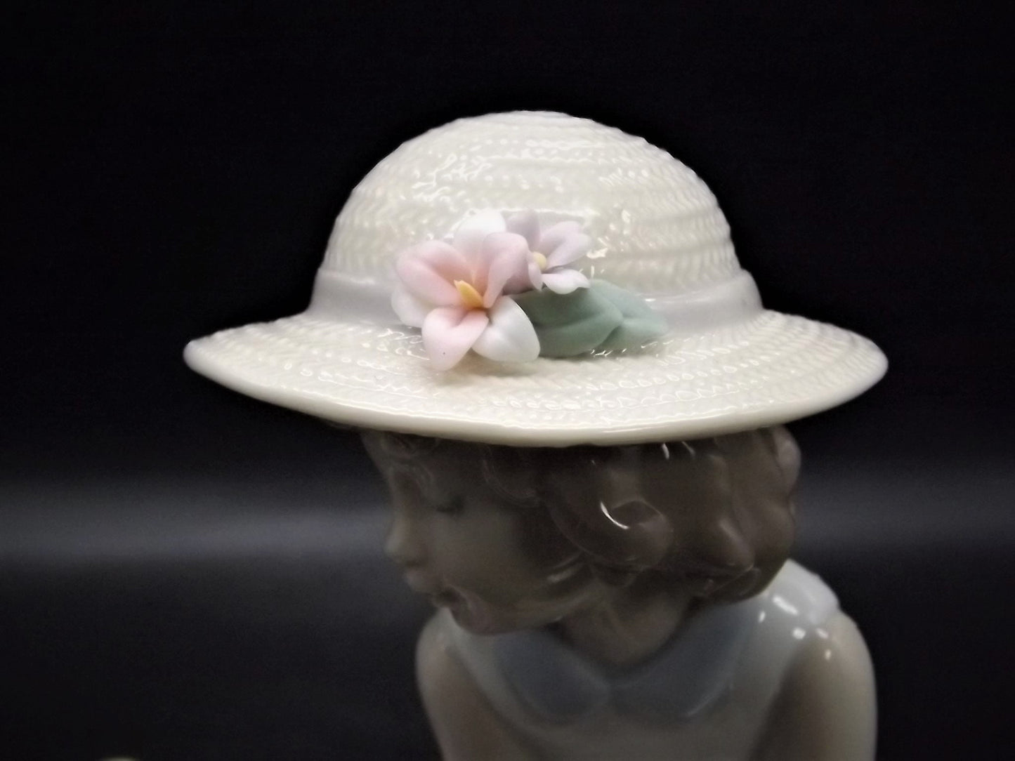 Vintage Lladro "Hello Little Squirrel" #6825 with original box. Girl and squirrel with flowers. 2 petals missing as shown in photos.