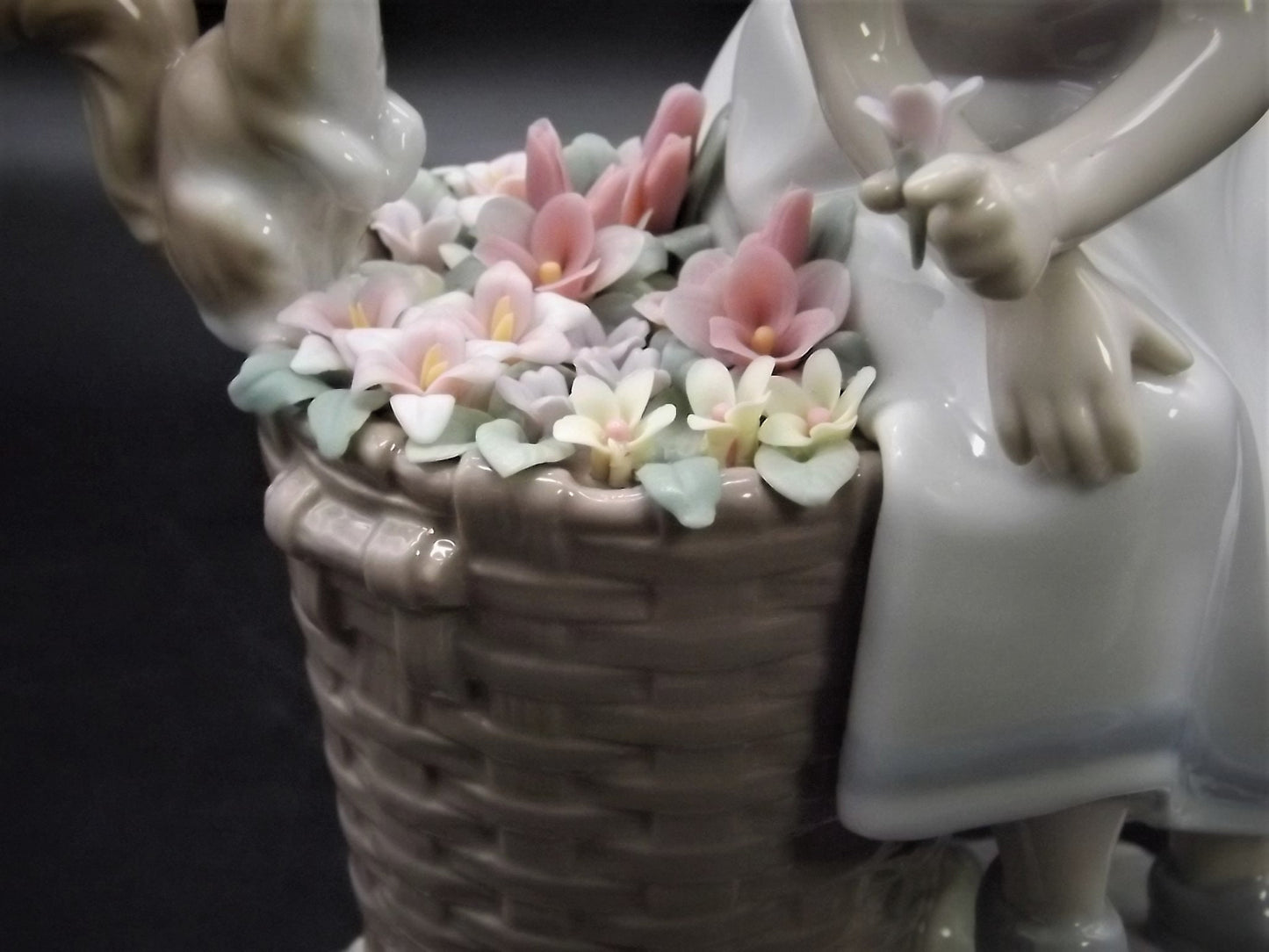 Vintage Lladro "Hello Little Squirrel" #6825 with original box. Girl and squirrel with flowers. 2 petals missing as shown in photos.