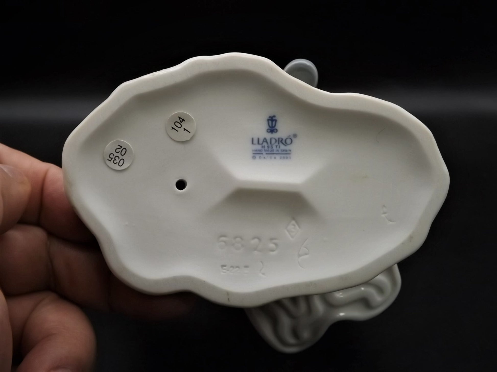 Vintage Lladro "Hello Little Squirrel" #6825 with original box. Girl and squirrel with flowers. 2 petals missing as shown in photos.