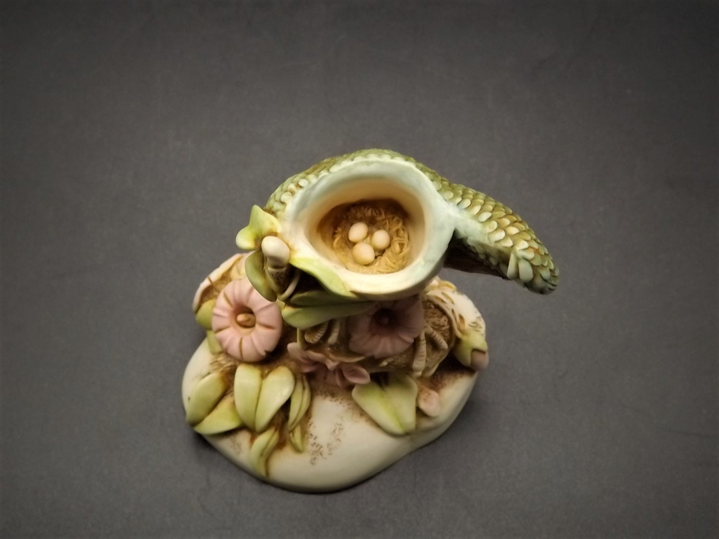 Retired 1999 Harmony Kingdom "Caw of the wild" infinity version piece Excellent condition with original box and COA. Rare eggs inside piece.