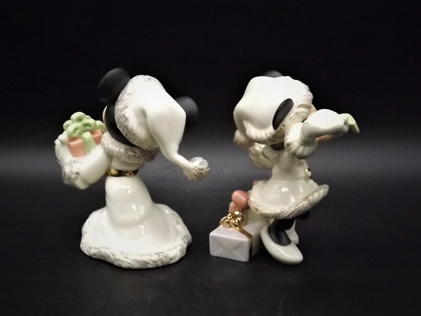 Lenox Christmas with Mickey and Minnie's Christmas Wish Porcelain Figurines. Minnie is holding Mistletoe and Mickey with a present. Great!