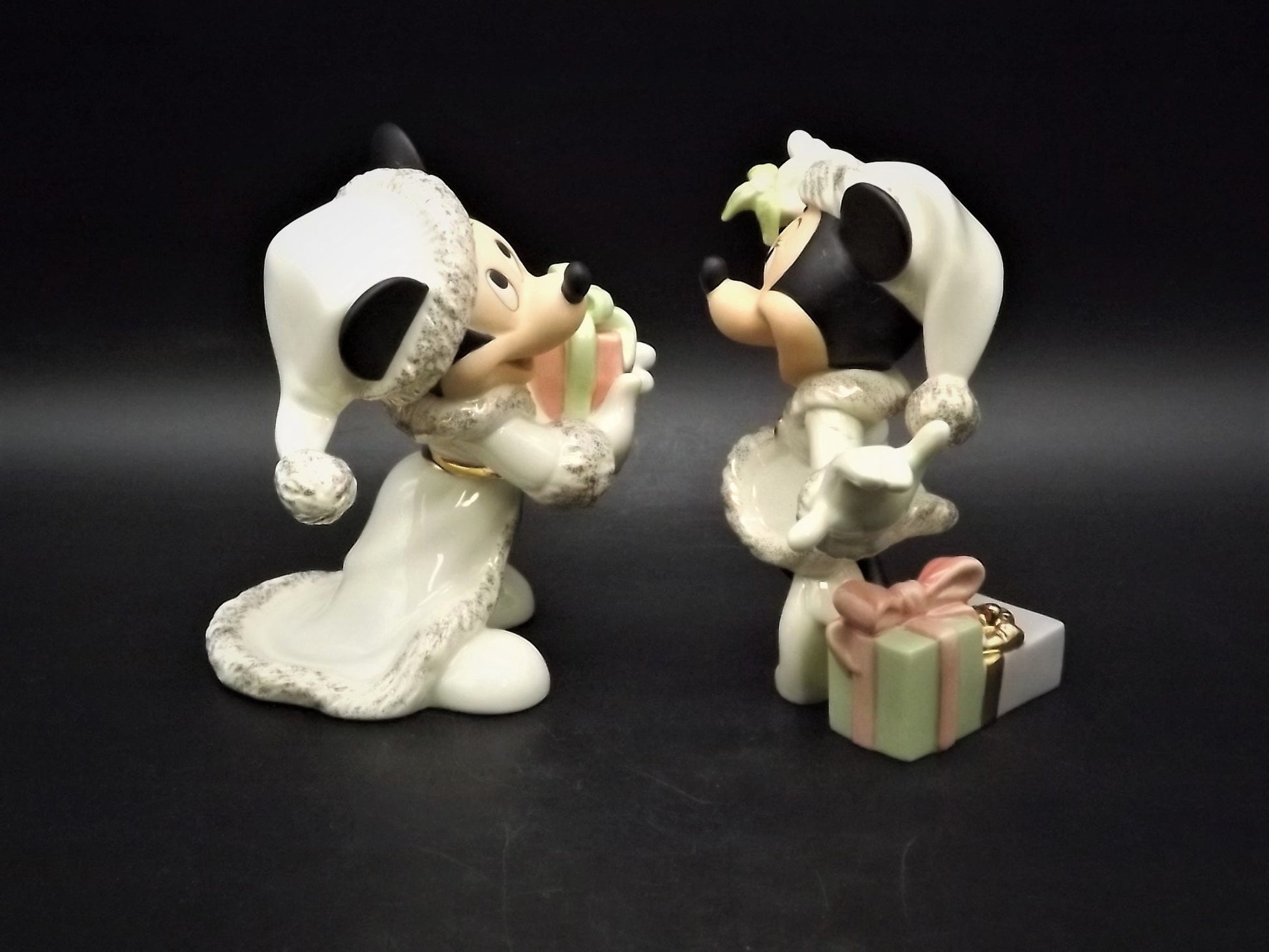Lenox Christmas with Mickey and Minnie's Christmas Wish Porcelain Figurines. Minnie is holding Mistletoe and Mickey with a present. Great!