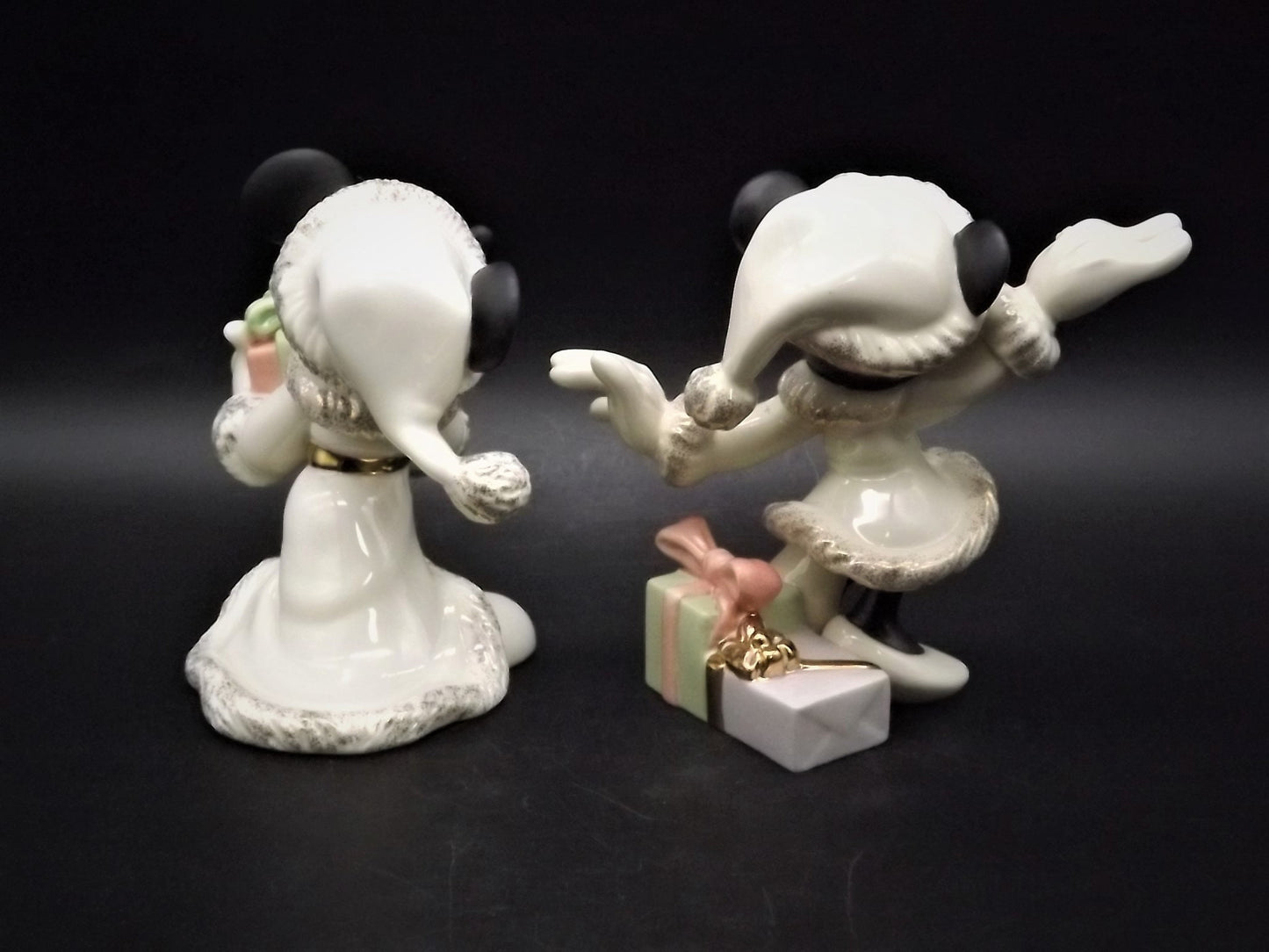 Lenox Christmas with Mickey and Minnie's Christmas Wish Porcelain Figurines. Minnie is holding Mistletoe and Mickey with a present. Great!