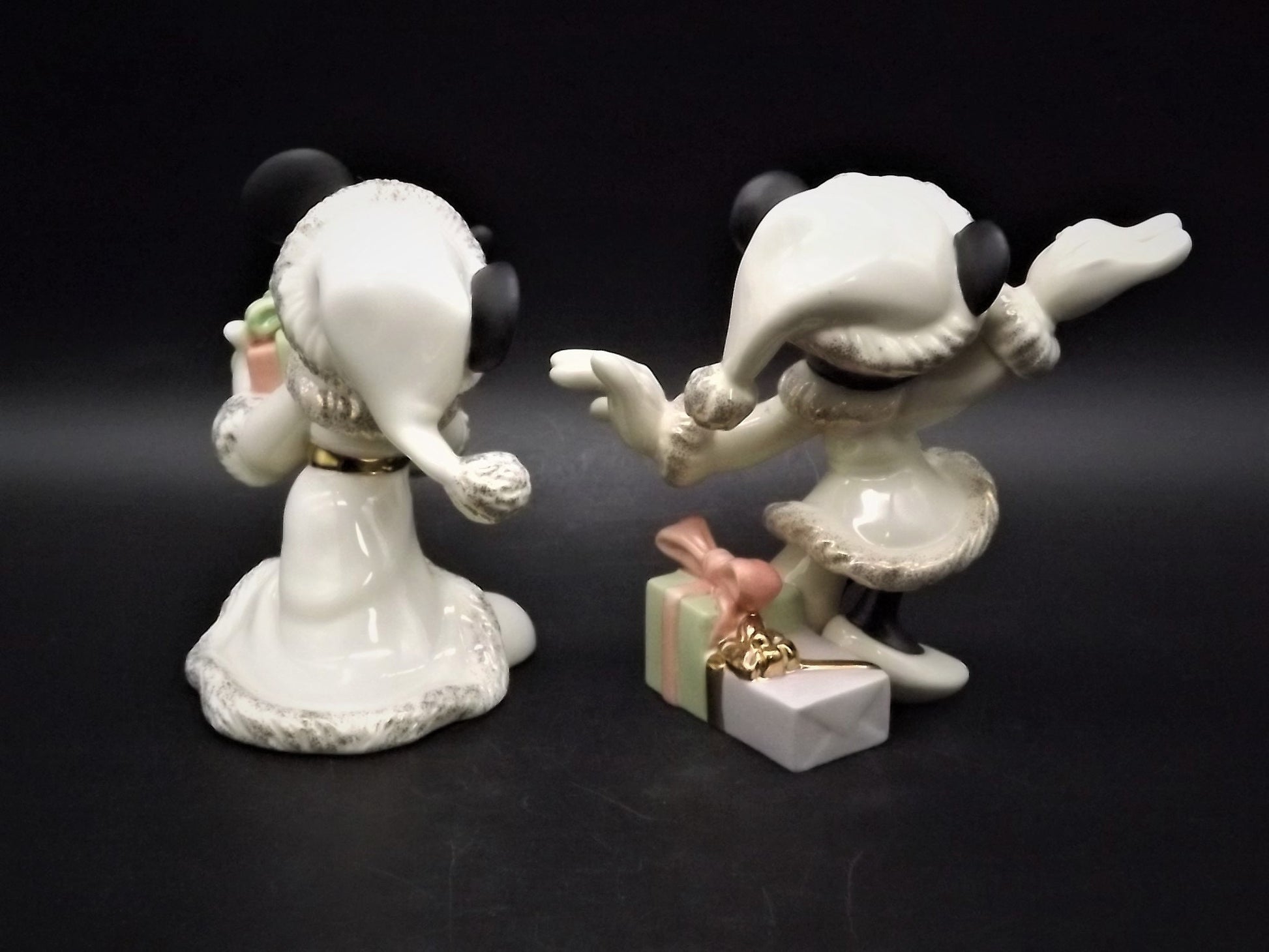 Lenox Christmas with Mickey and Minnie's Christmas Wish Porcelain Figurines. Minnie is holding Mistletoe and Mickey with a present. Great!