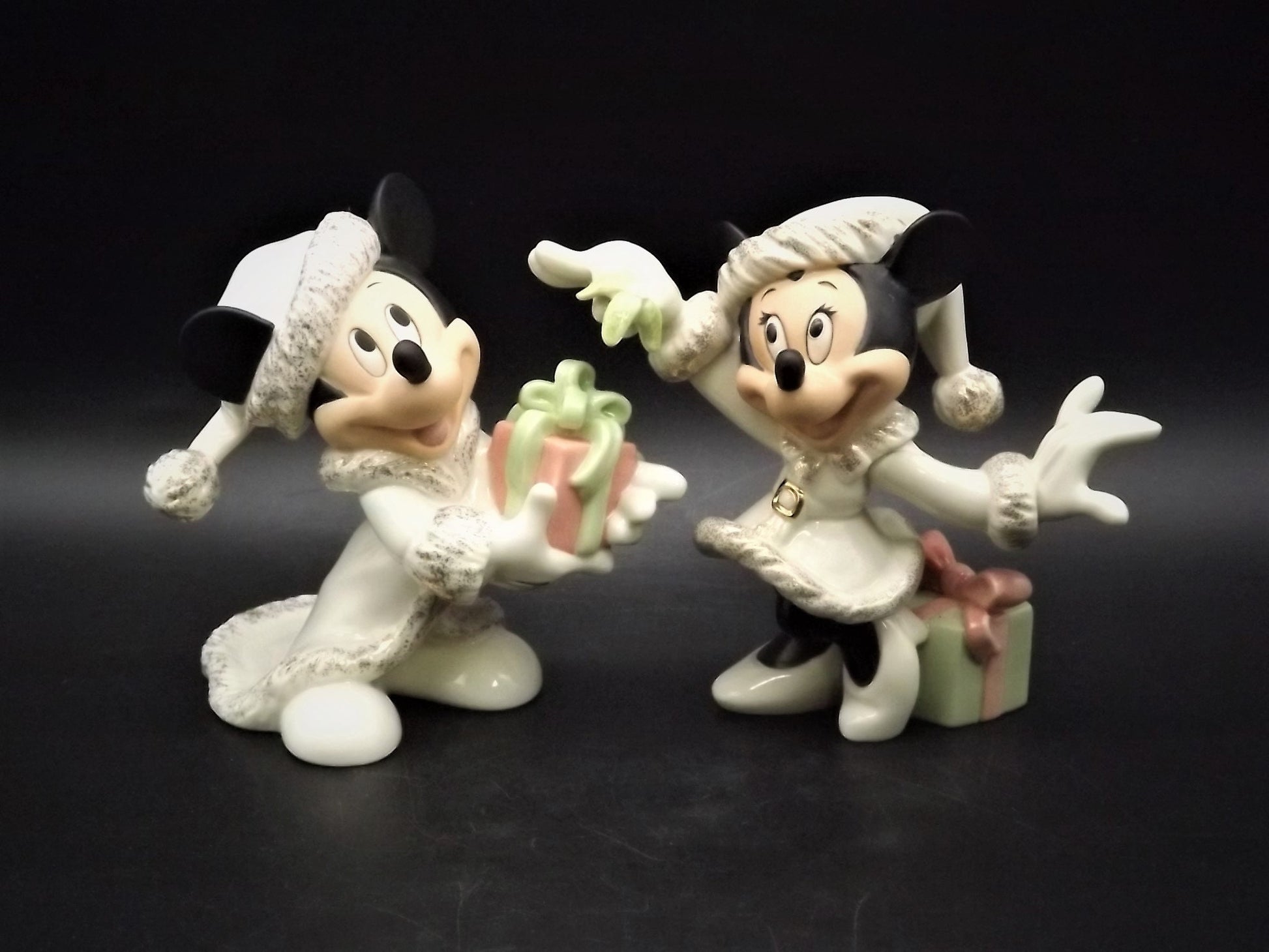 Lenox Christmas with Mickey and Minnie's Christmas Wish Porcelain Figurines. Minnie is holding Mistletoe and Mickey with a present. Great!