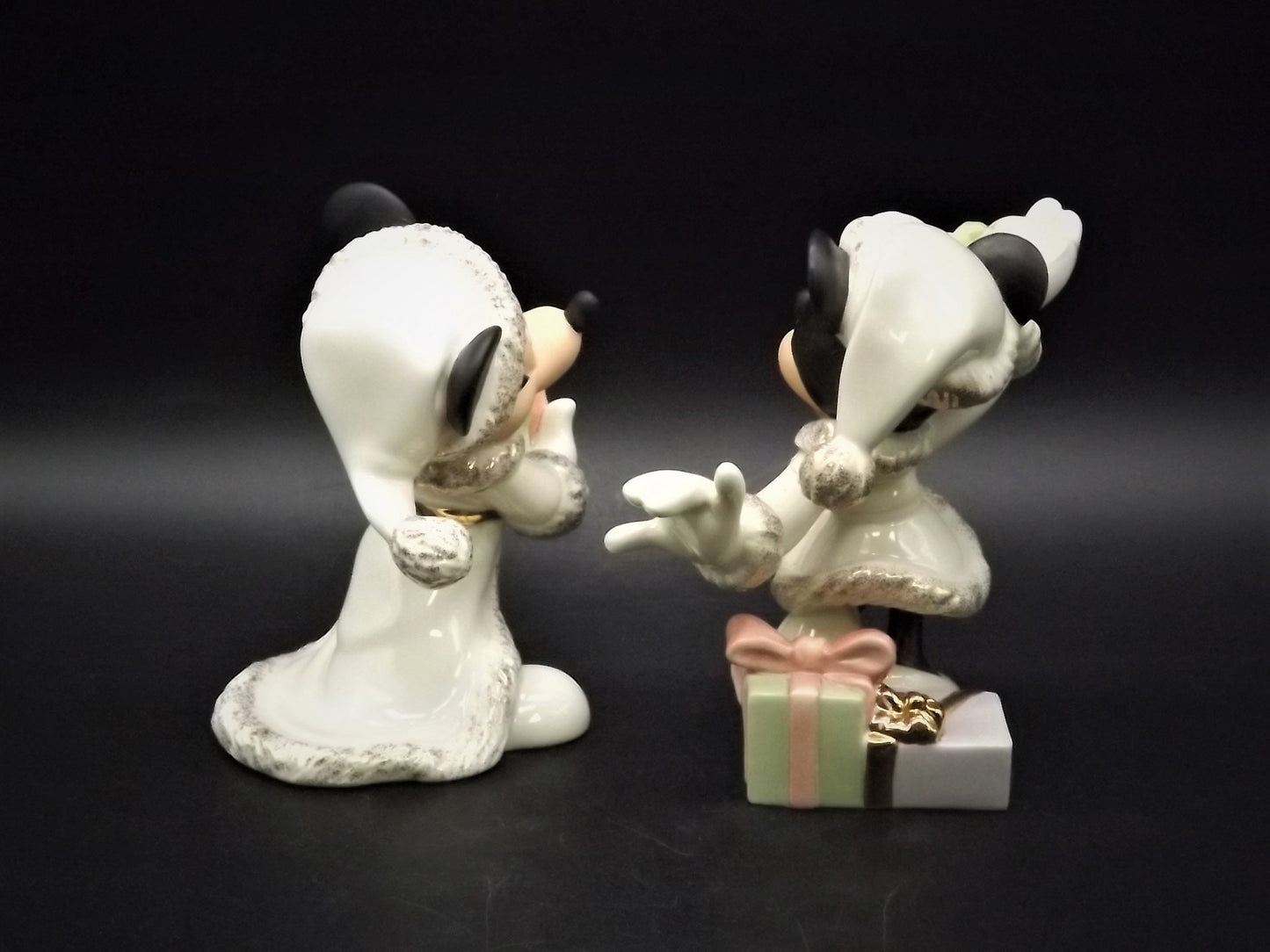 Lenox Christmas with Mickey and Minnie's Christmas Wish Porcelain Figurines. Minnie is holding Mistletoe and Mickey with a present. Great!