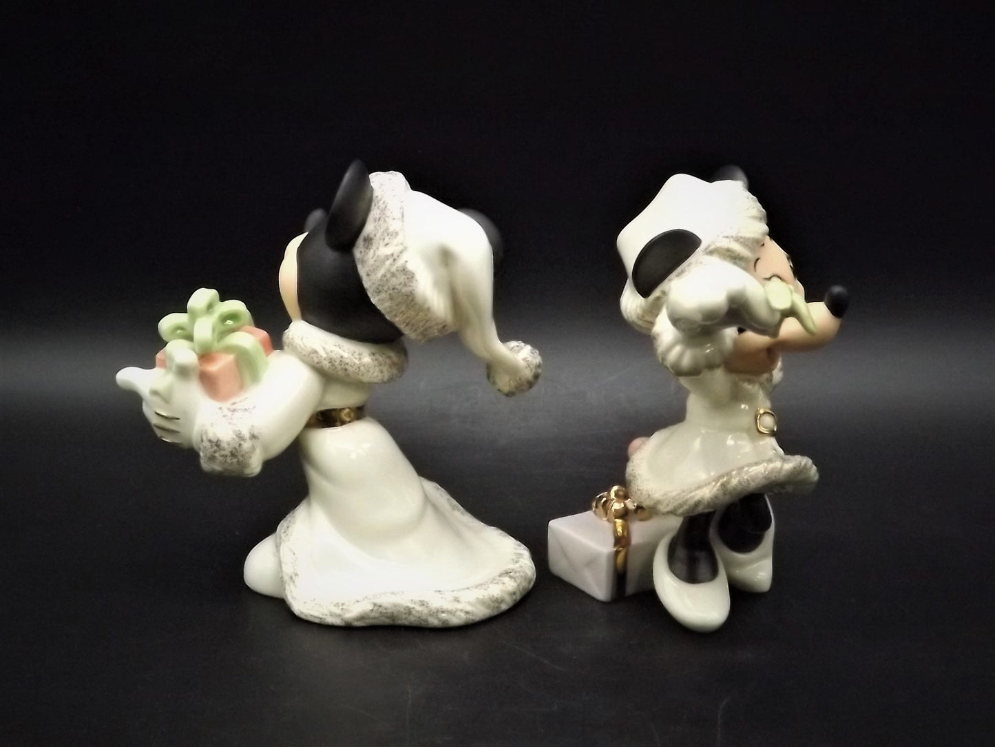 Lenox Christmas with Mickey and Minnie's Christmas Wish Porcelain Figurines. Minnie is holding Mistletoe and Mickey with a present. Great!