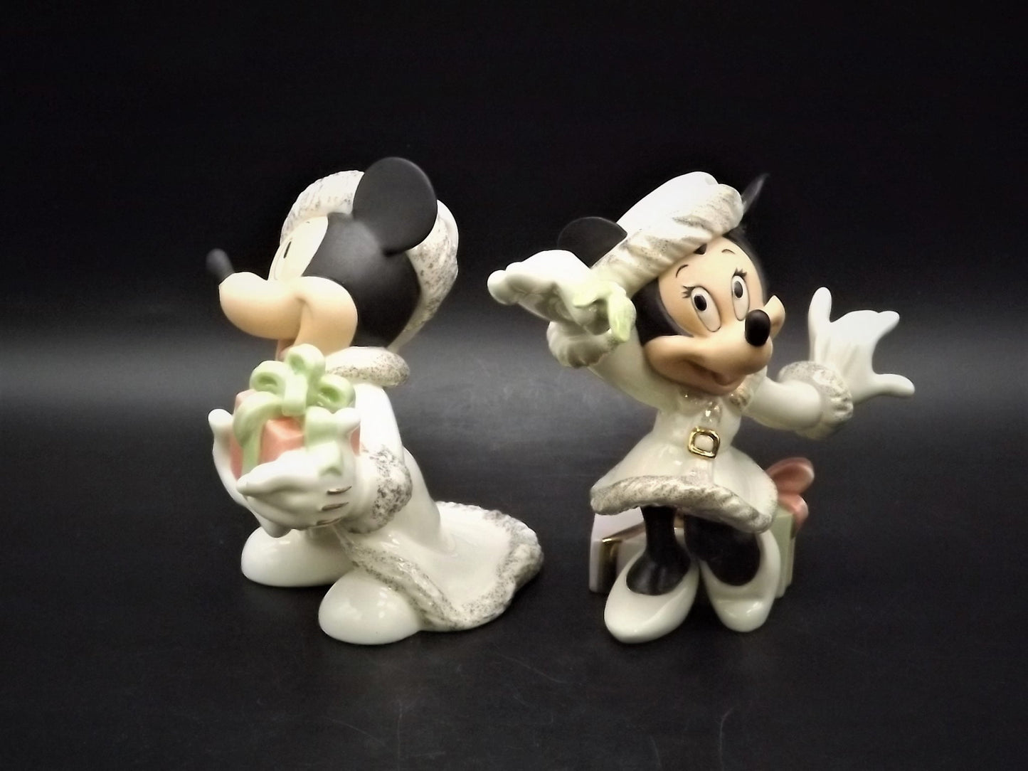 Lenox Christmas with Mickey and Minnie's Christmas Wish Porcelain Figurines. Minnie is holding Mistletoe and Mickey with a present. Great!