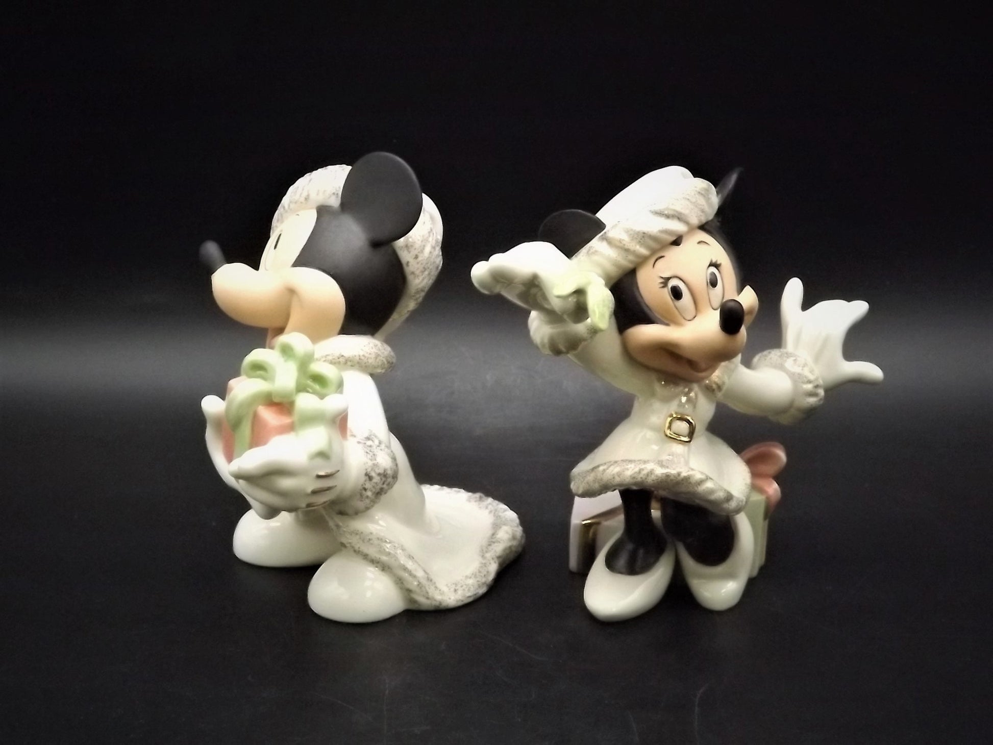 Lenox Christmas with Mickey and Minnie's Christmas Wish Porcelain Figurines. Minnie is holding Mistletoe and Mickey with a present. Great!