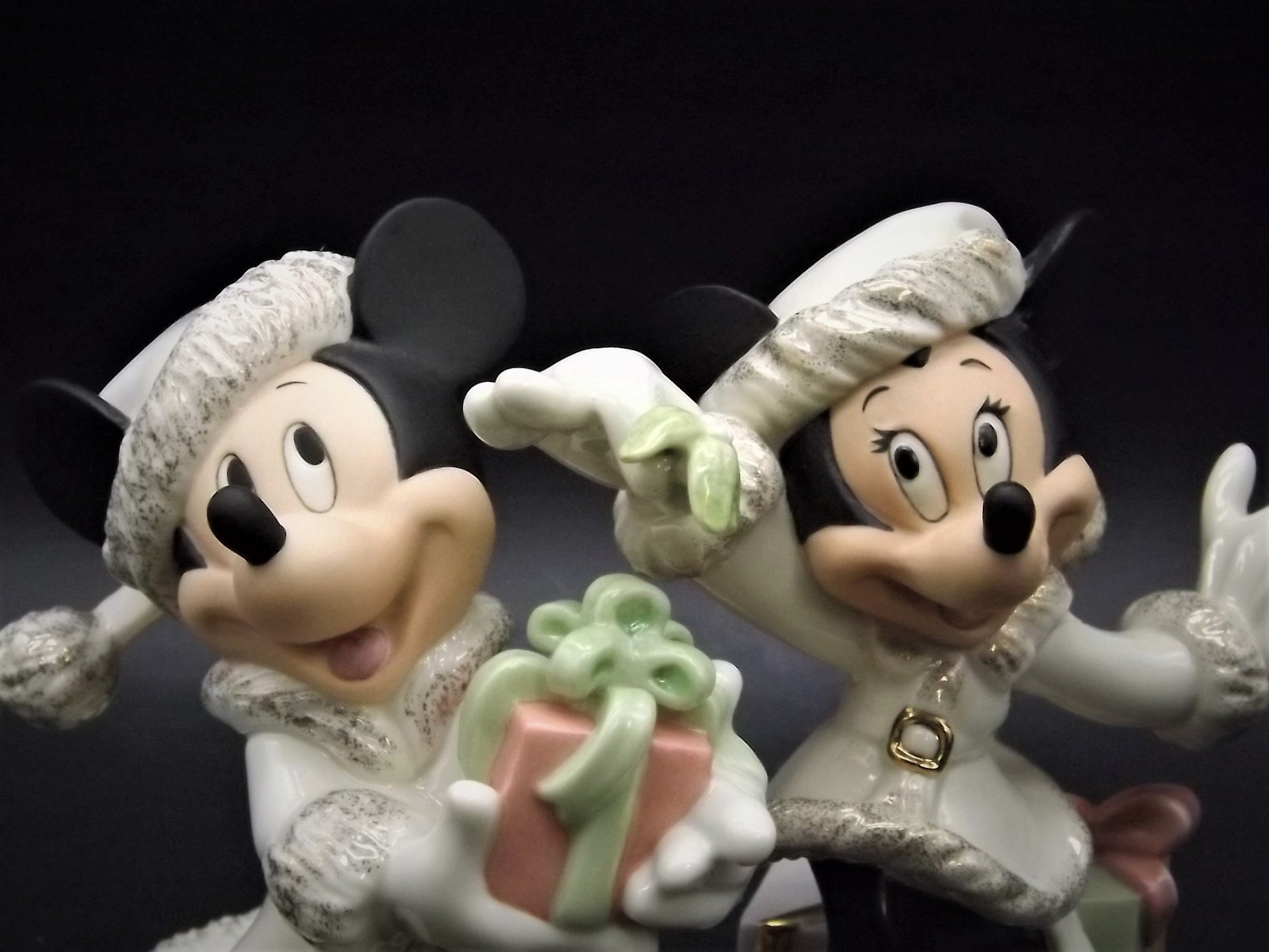 Lenox Christmas with Mickey and Minnie's Christmas Wish Porcelain Figurines. Minnie is holding Mistletoe and Mickey with a present. Great!