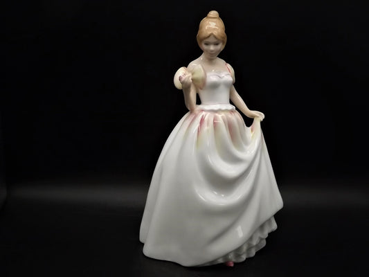 Vintage Royal Doulton "Gift of Love" figurine HN 3427. Excellent condition young lady with a flower!