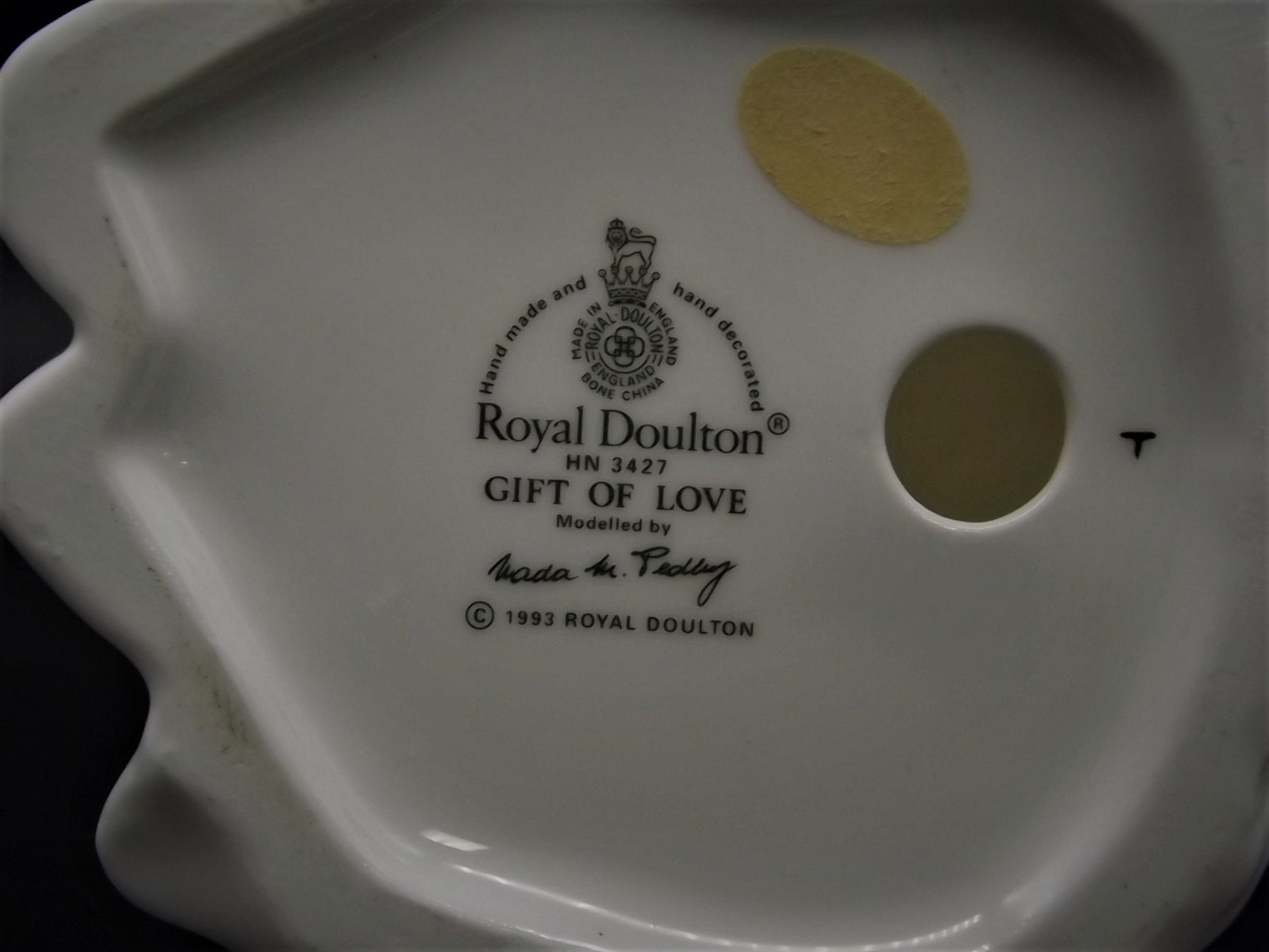 Vintage Royal Doulton "Gift of Love" figurine HN 3427. Excellent condition young lady with a flower!