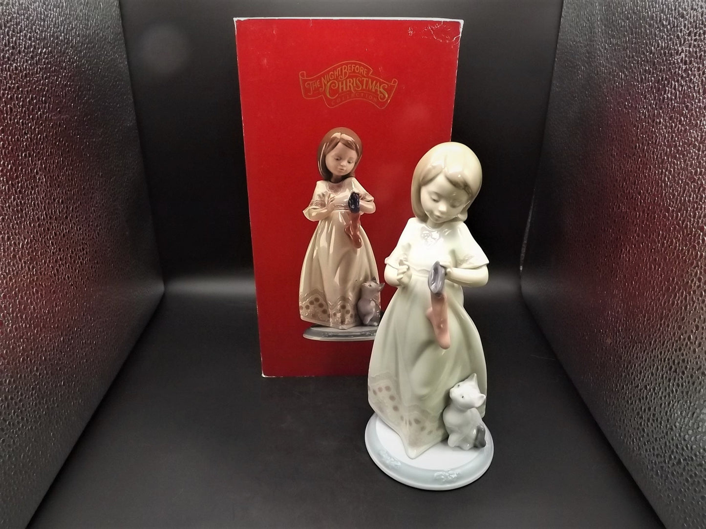Vintage 1999 Lladro Night before Christmas Collection "A Stocking for kitty" #6669 with original box. Child hanging a stocking for her pet.