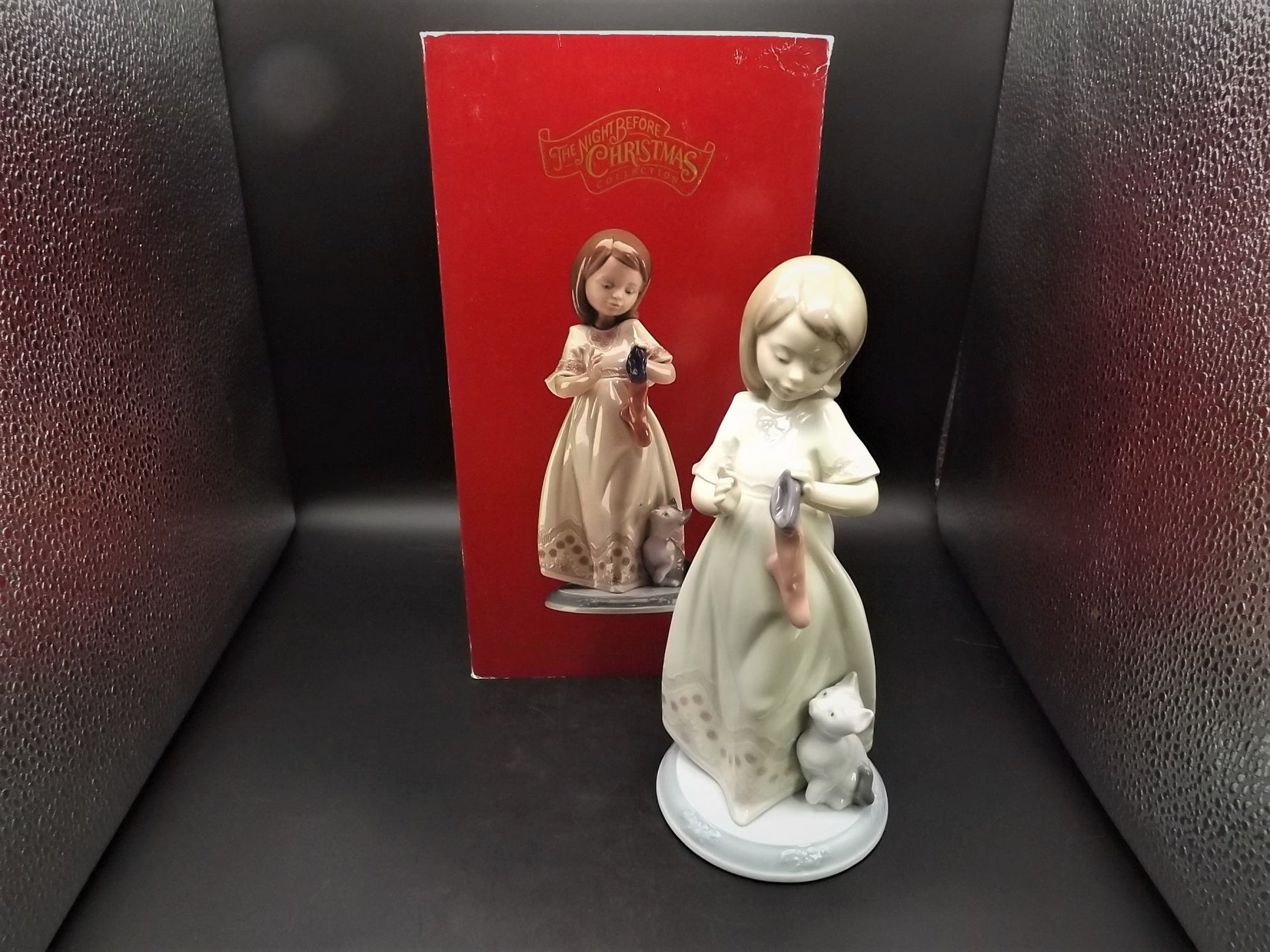 Vintage 1999 Lladro Night before Christmas Collection "A Stocking for kitty" #6669 with original box. Child hanging a stocking for her pet.