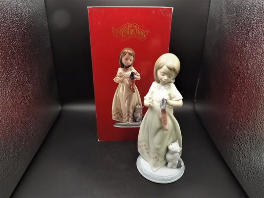 Vintage 1999 Lladro Night before Christmas Collection "A Stocking for kitty" #6669 with original box. Child hanging a stocking for her pet.
