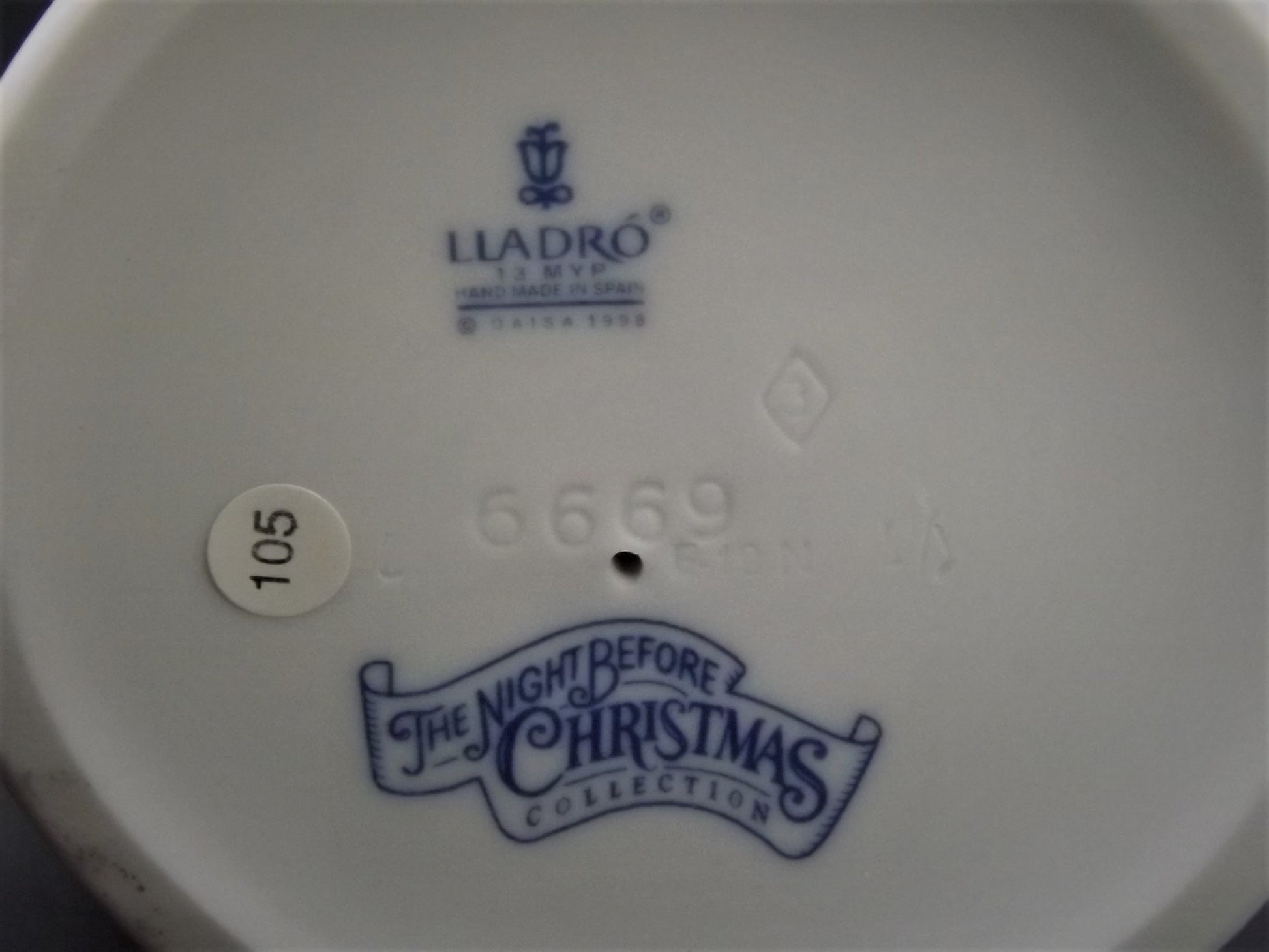 Vintage 1999 Lladro Night before Christmas Collection "A Stocking for kitty" #6669 with original box. Child hanging a stocking for her pet.