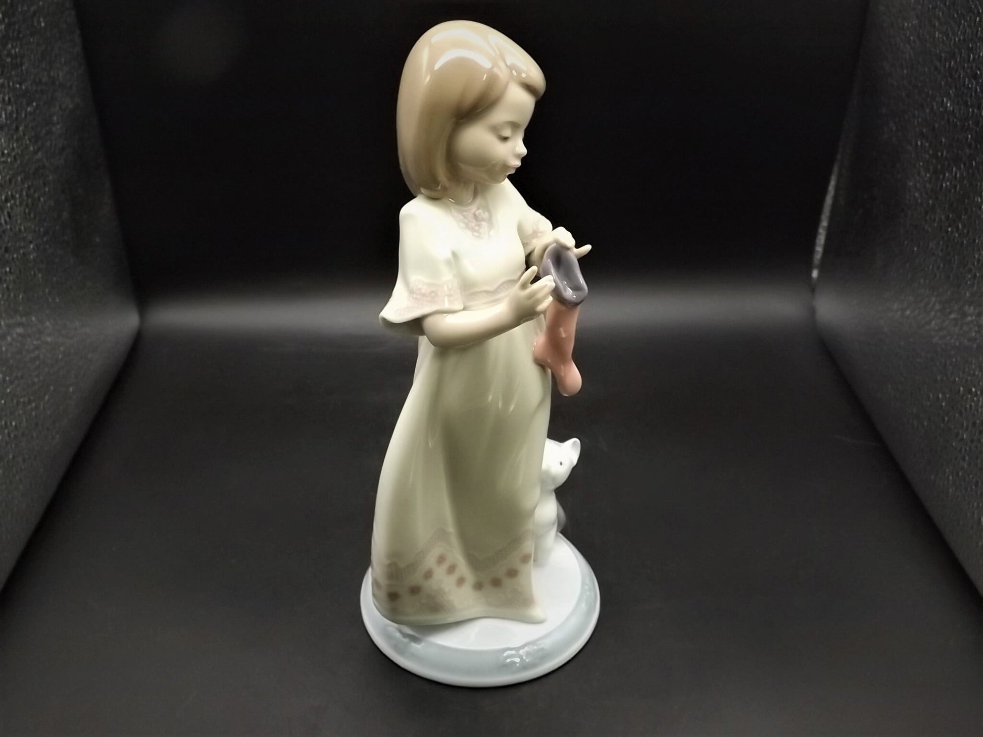 Vintage 1999 Lladro Night before Christmas Collection "A Stocking for kitty" #6669 with original box. Child hanging a stocking for her pet.