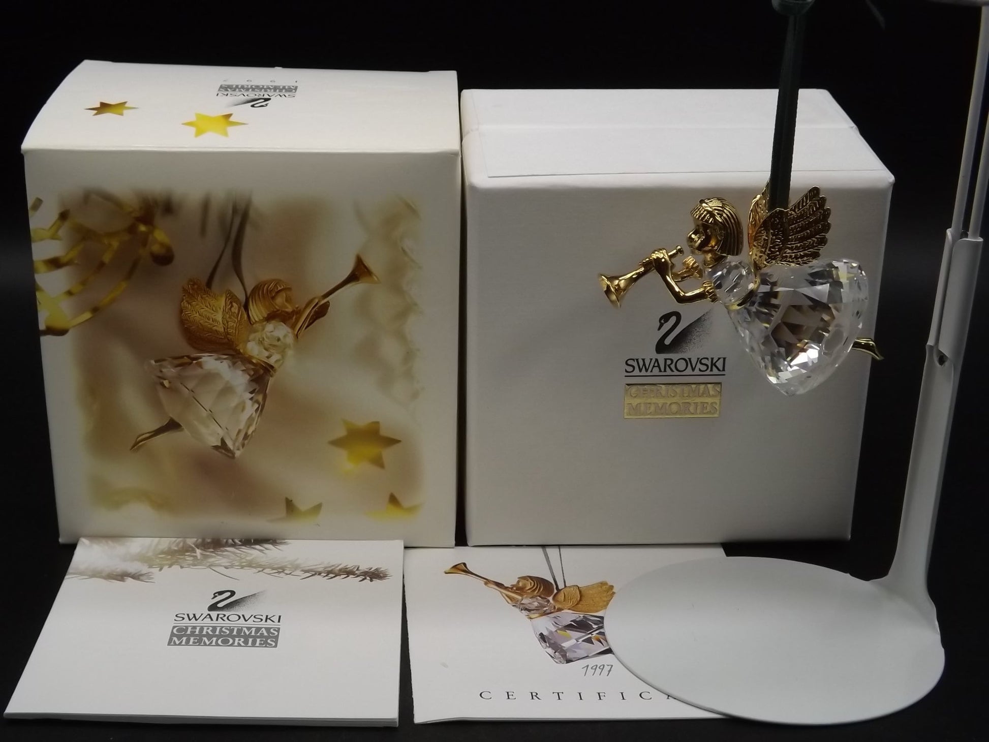 Vintage Swarovski Crystal Memories 1997 "Angel Playing Horn" Figurine. Excellent Condition with original box.