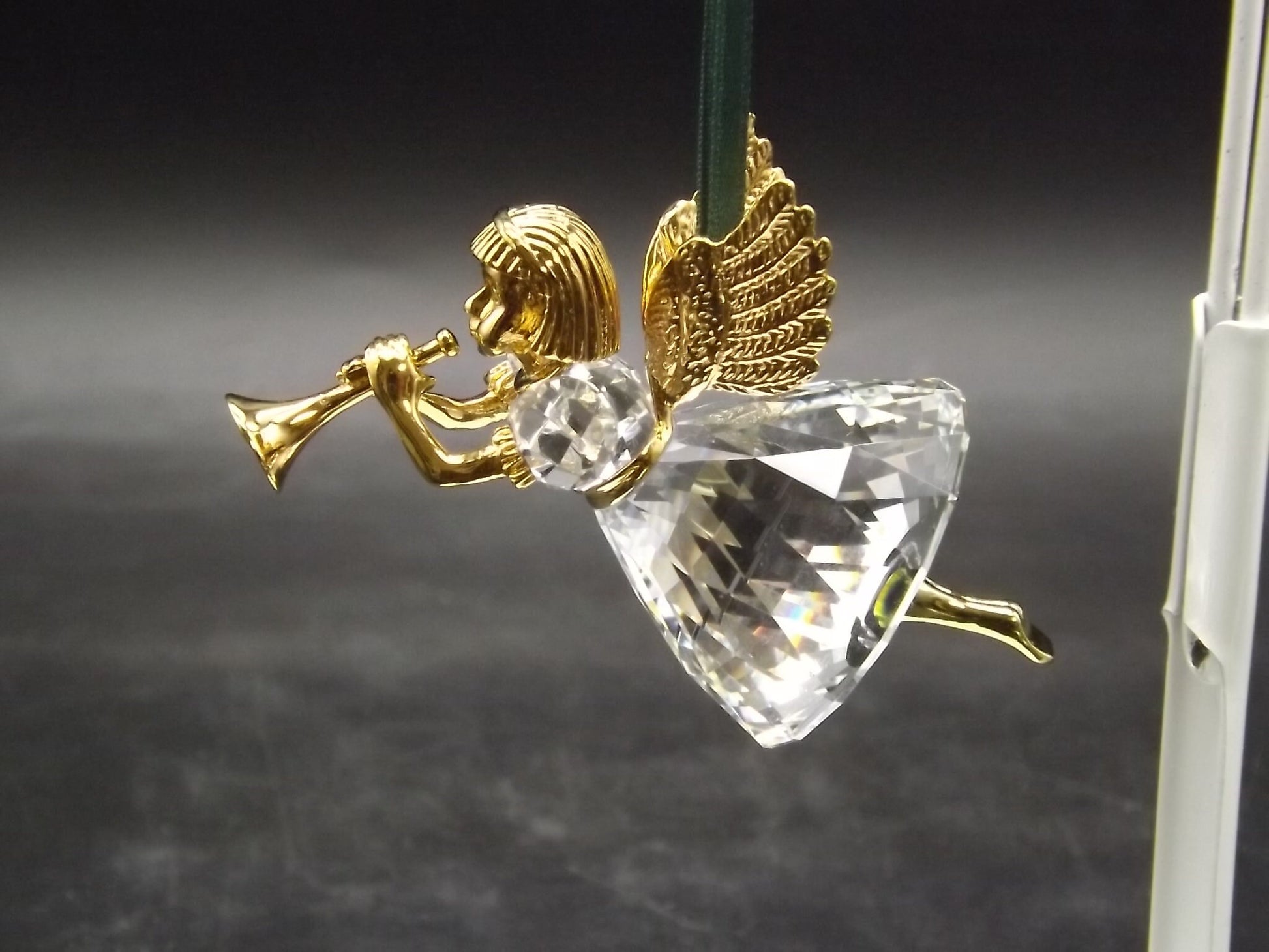 Vintage Swarovski Crystal Memories 1997 "Angel Playing Horn" Figurine. Excellent Condition with original box.