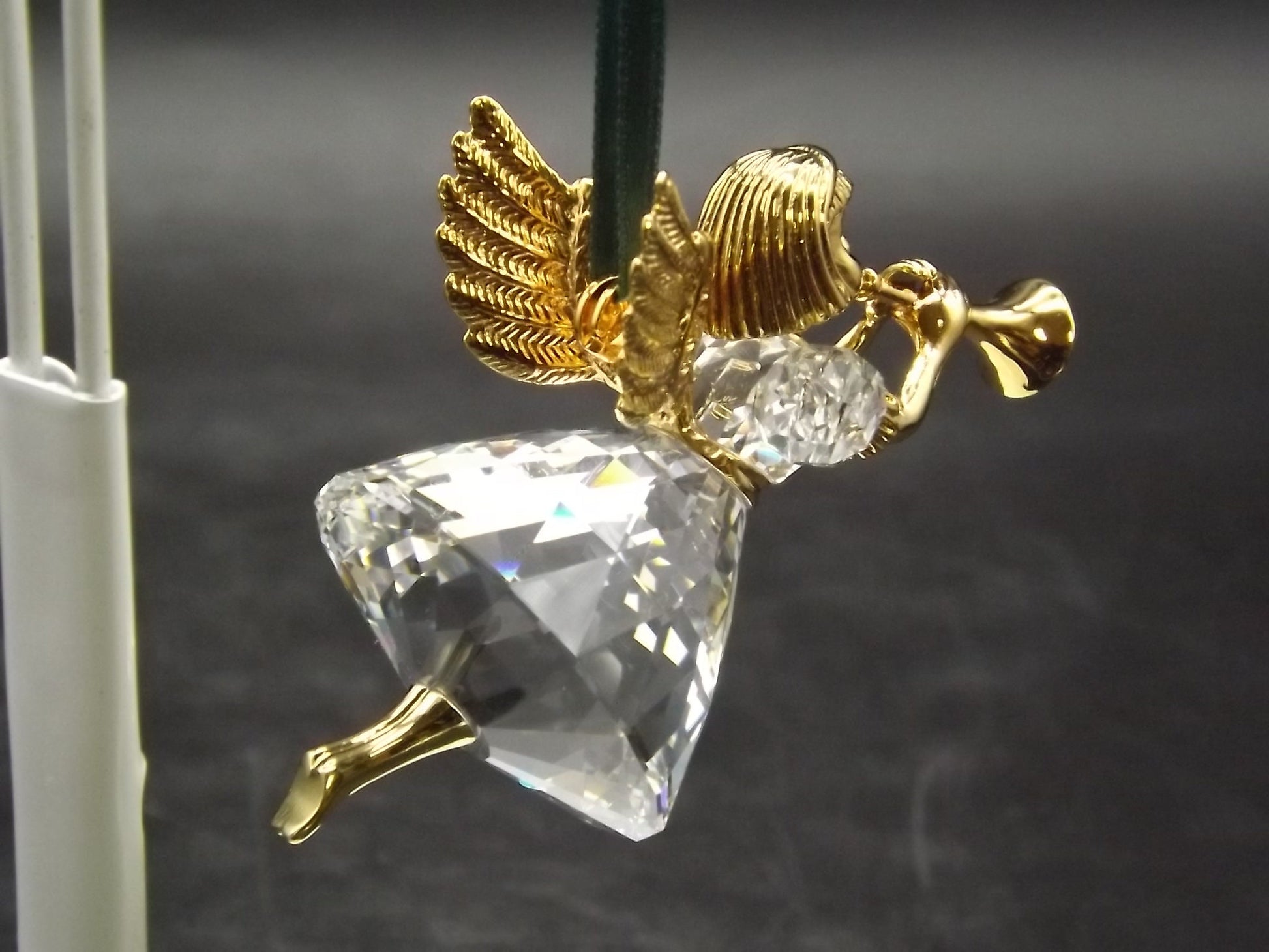 Vintage Swarovski Crystal Memories 1997 "Angel Playing Horn" Figurine. Excellent Condition with original box.