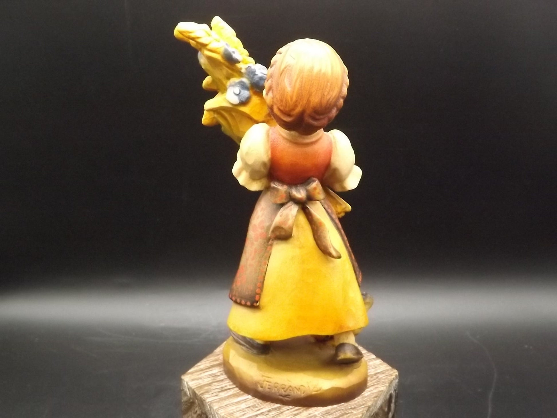 Vintage Anri "Golden Sheaves" carved wood figurine. Designed by Juan Ferrandiz numbered 338/2250. Young girl holding a sheaf of grain.