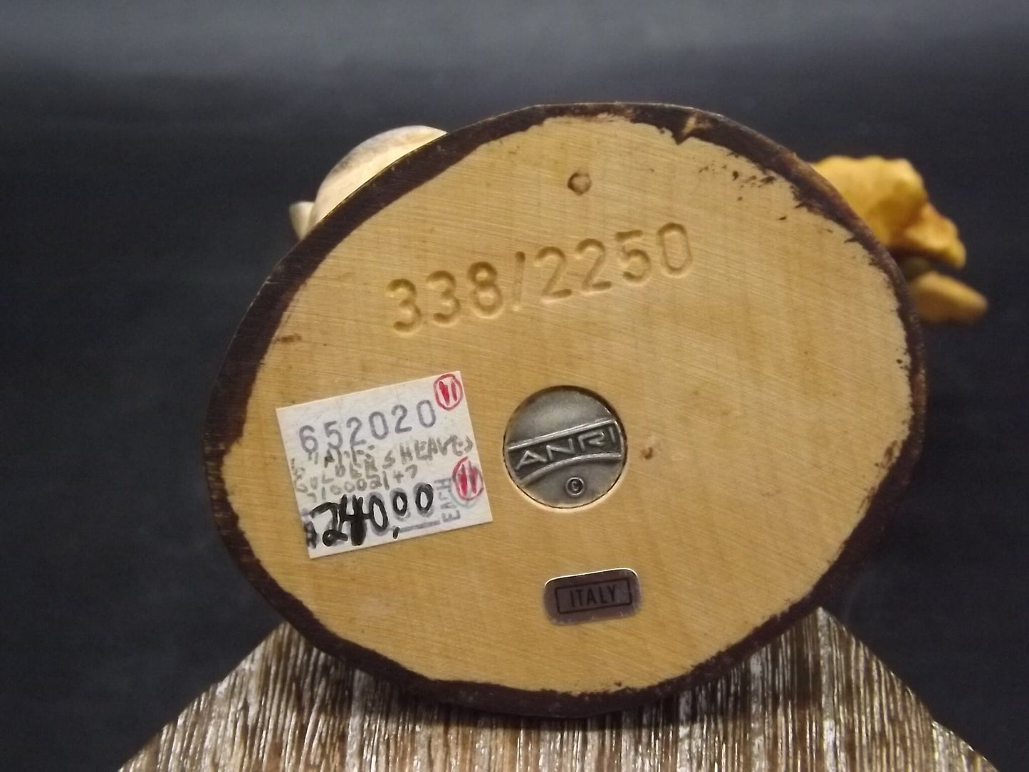 Vintage Anri "Golden Sheaves" carved wood figurine. Designed by Juan Ferrandiz numbered 338/2250. Young girl holding a sheaf of grain.