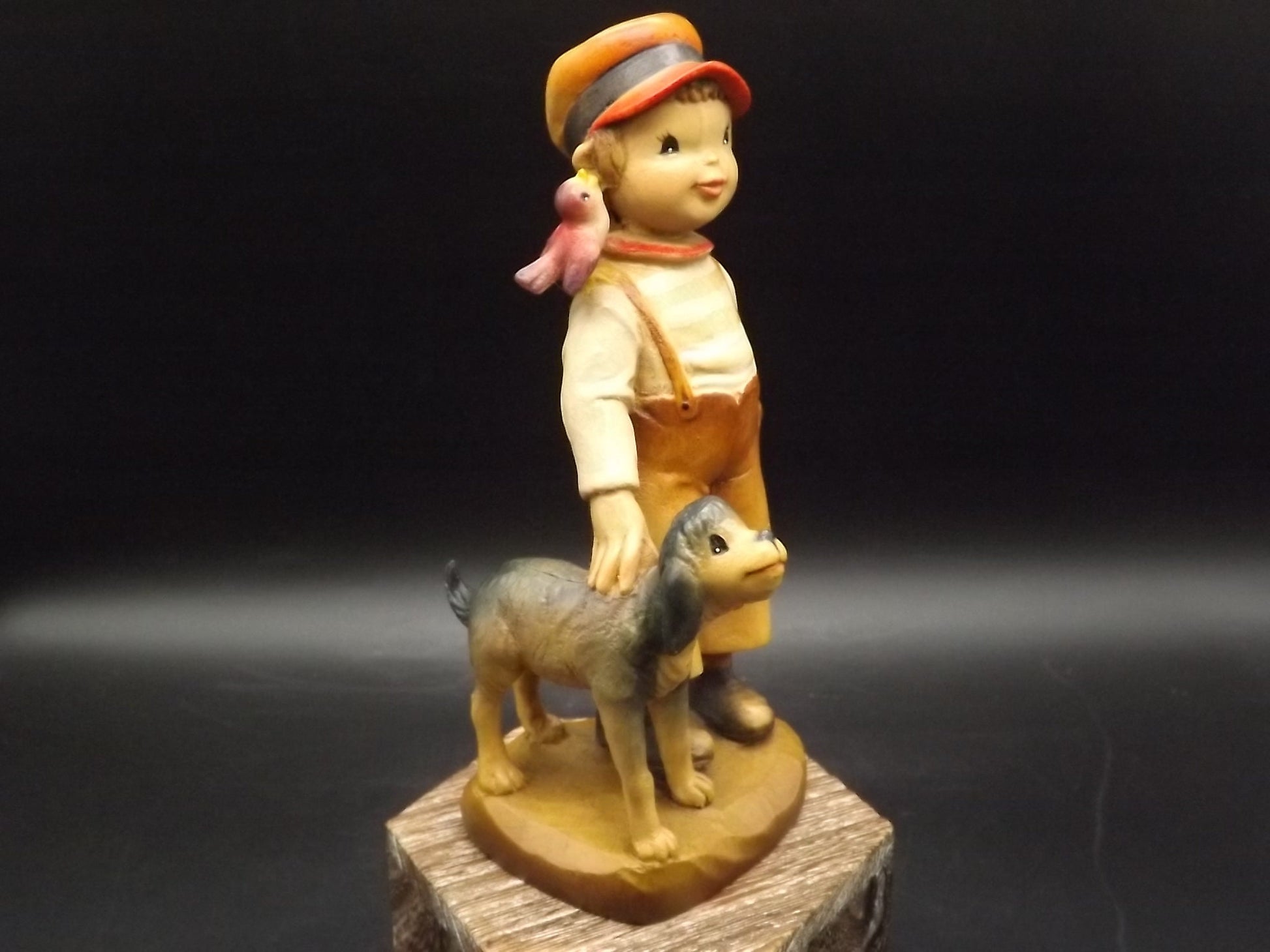 Vintage Anri "High Hopes" carved wood figurine. Designed by Juan Ferrandiz. Young boy with his pet dog and a bird perched on his shoulder.