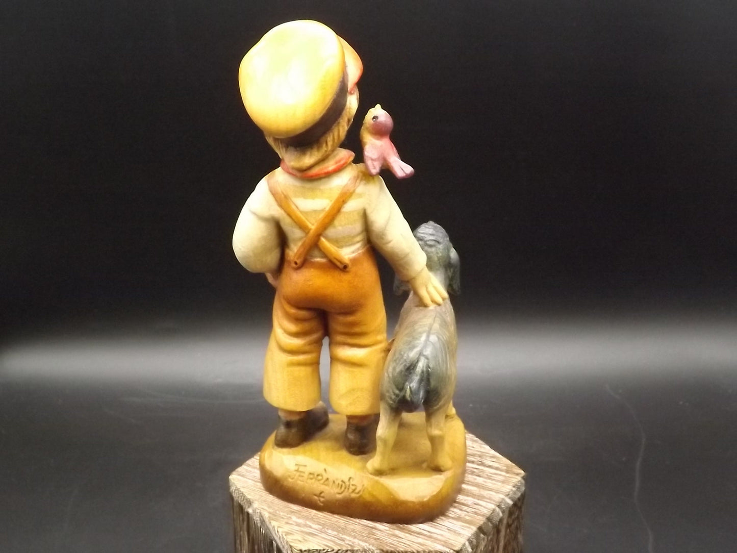 Vintage Anri "High Hopes" carved wood figurine. Designed by Juan Ferrandiz. Young boy with his pet dog and a bird perched on his shoulder.