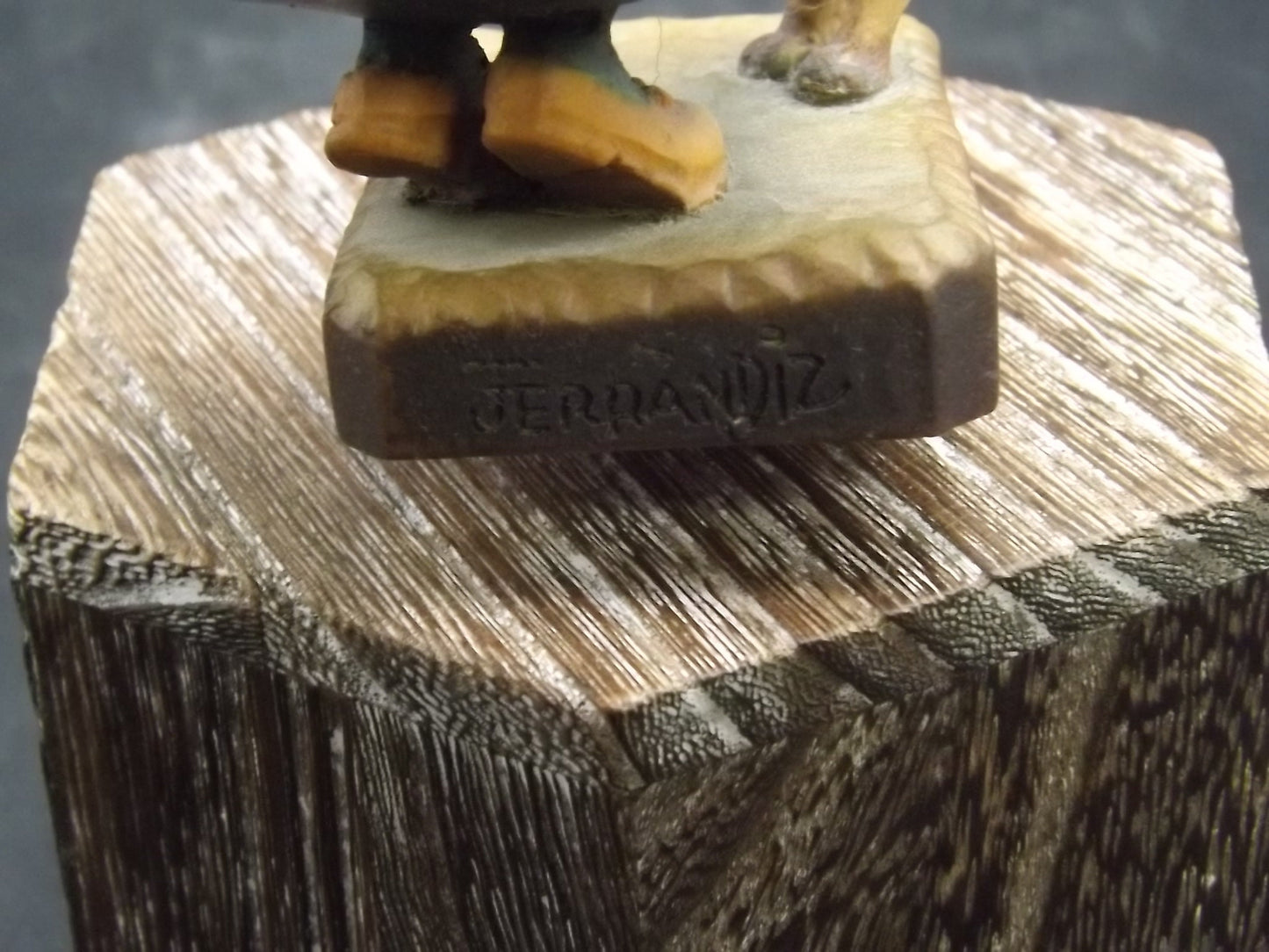 Vintage Anri "Harvest Help" carved wood figurine. Designed by Juan Ferrandiz. Young girl holding a bunch of grapes with her puppy.