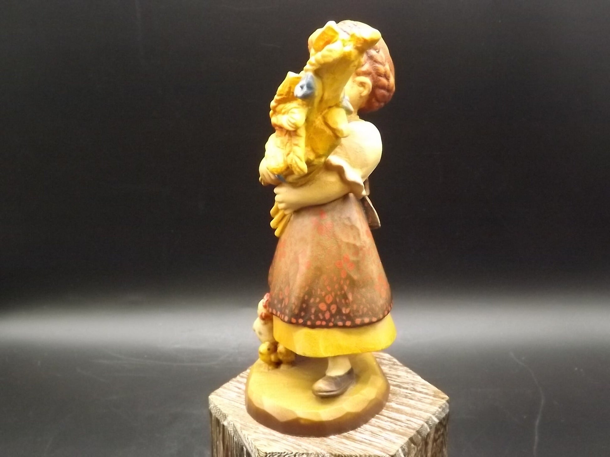 Vintage Anri "Golden Sheaves" carved wood figurine. Designed by Juan Ferrandiz numbered 338/2250. Young girl holding a sheaf of grain.