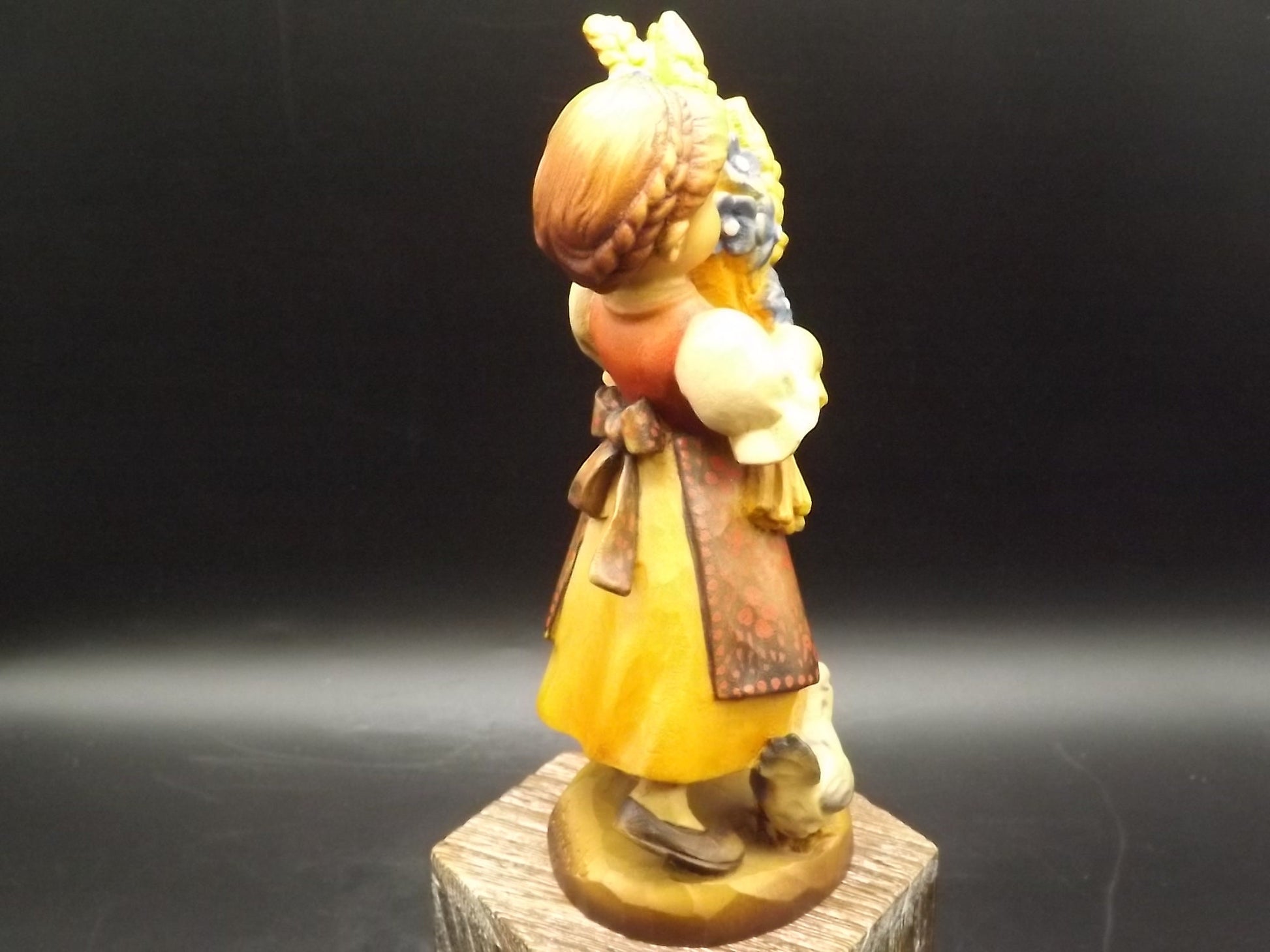 Vintage Anri "Golden Sheaves" carved wood figurine. Designed by Juan Ferrandiz numbered 338/2250. Young girl holding a sheaf of grain.