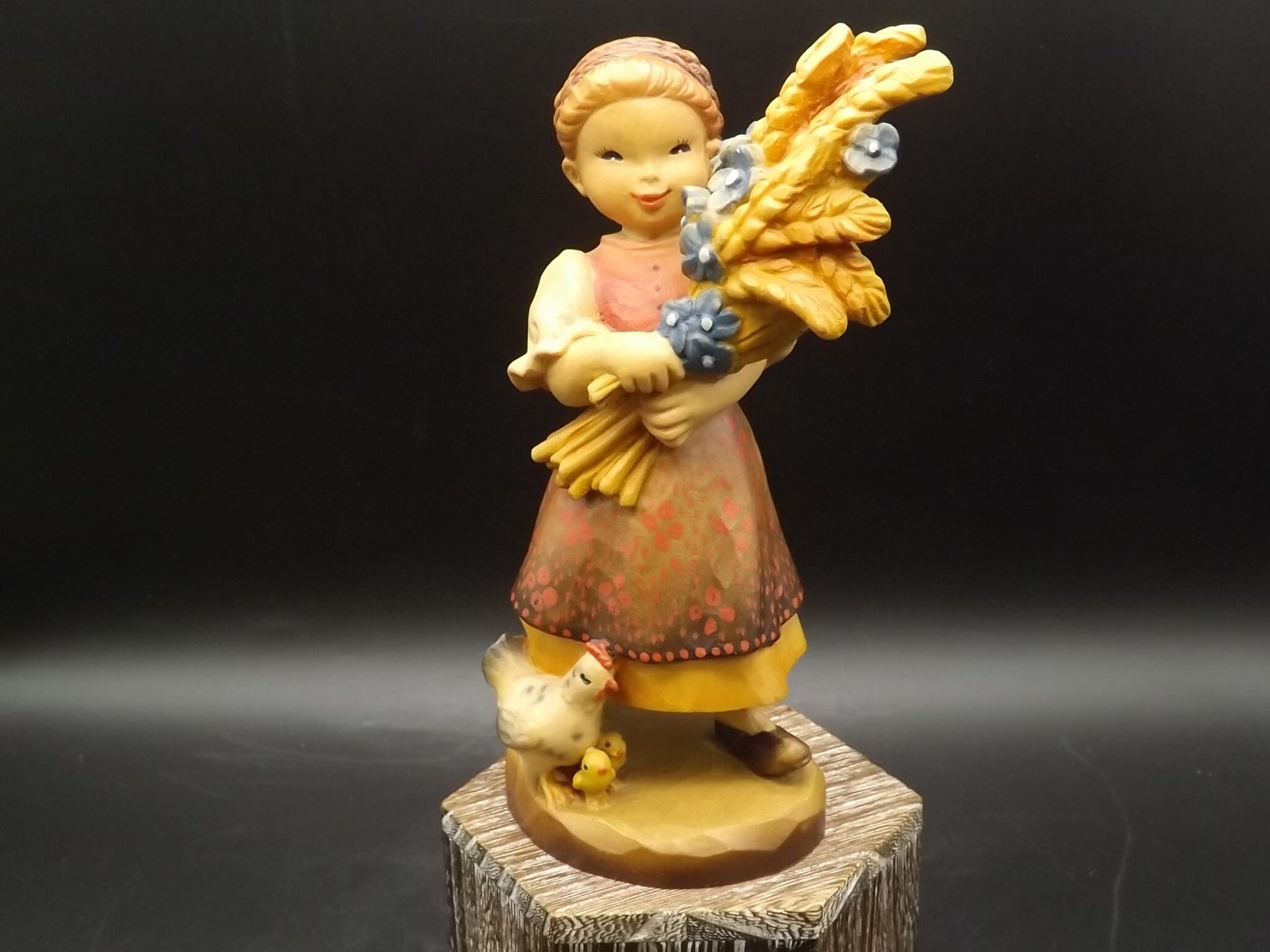Vintage Anri "Golden Sheaves" carved wood figurine. Designed by Juan Ferrandiz numbered 338/2250. Young girl holding a sheaf of grain.