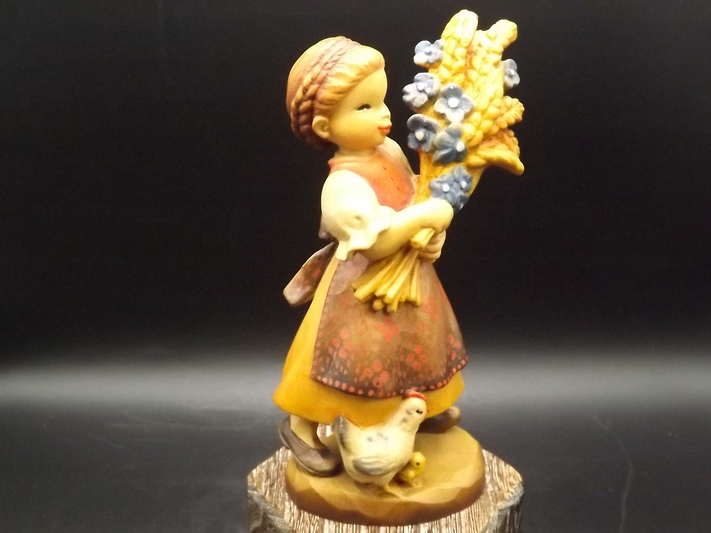 Vintage Anri "Golden Sheaves" carved wood figurine. Designed by Juan Ferrandiz numbered 338/2250. Young girl holding a sheaf of grain.