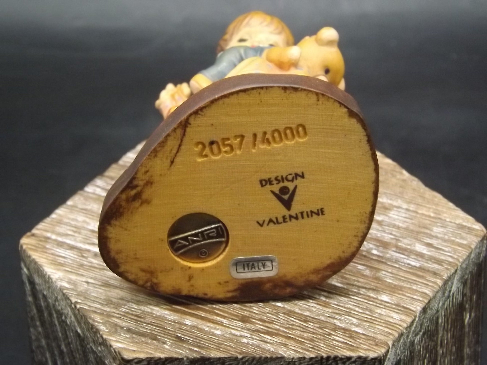 Vintage Anri "Good as new" carved wood figurine. Designed by Sarah Kay numbered 2057/4000. Young girl repairing her Teddy Bear.