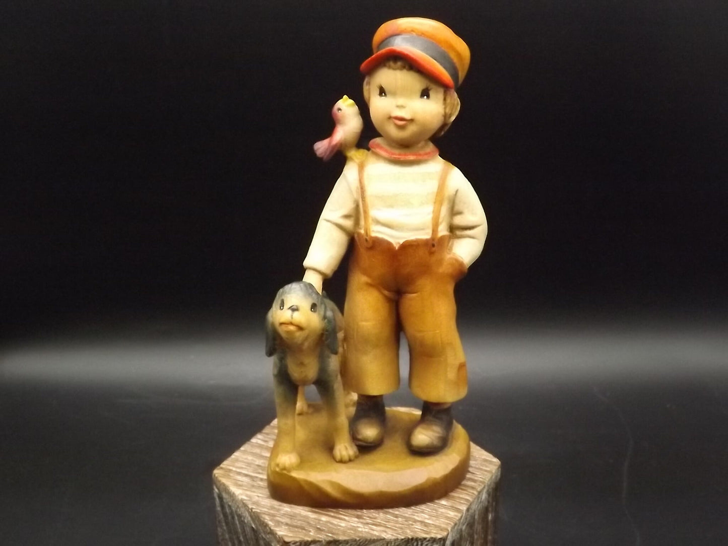 Vintage Anri "High Hopes" carved wood figurine. Designed by Juan Ferrandiz. Young boy with his pet dog and a bird perched on his shoulder.