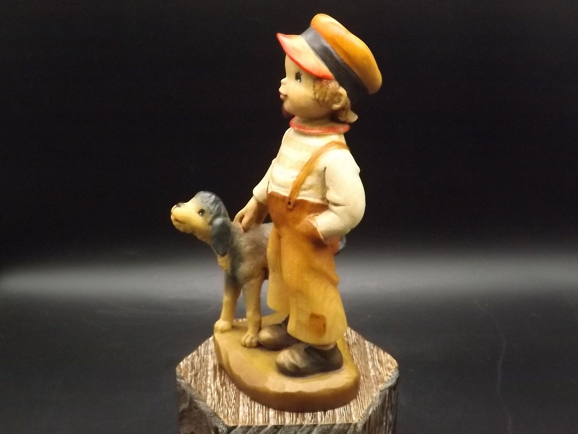 Vintage Anri "High Hopes" carved wood figurine. Designed by Juan Ferrandiz. Young boy with his pet dog and a bird perched on his shoulder.