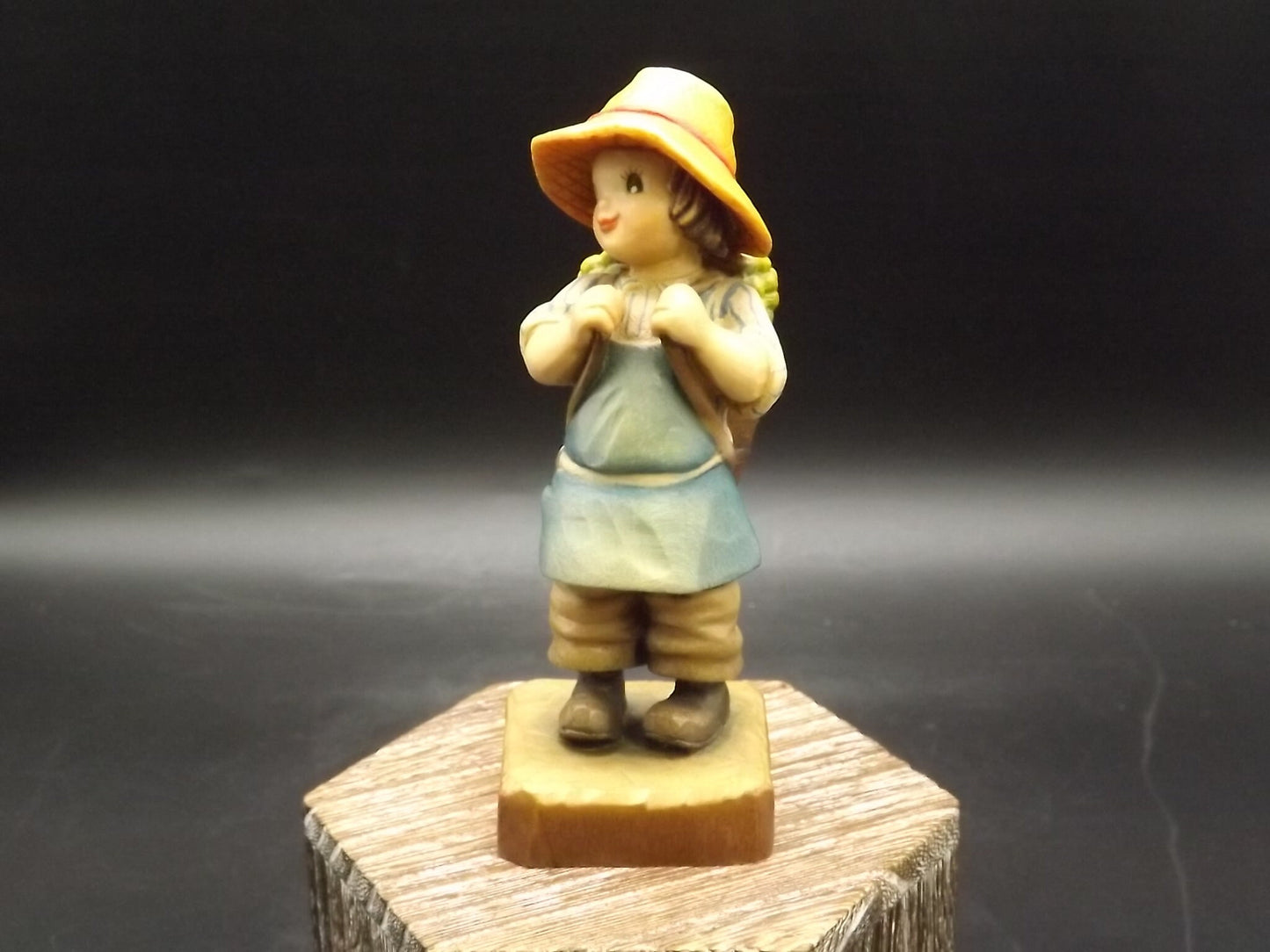 Vintage Anri "Harvest Time" Light carved wood figurine. Designed by Juan Ferrandiz. Young boy Carrying a basket of grapes. Number 4 club.