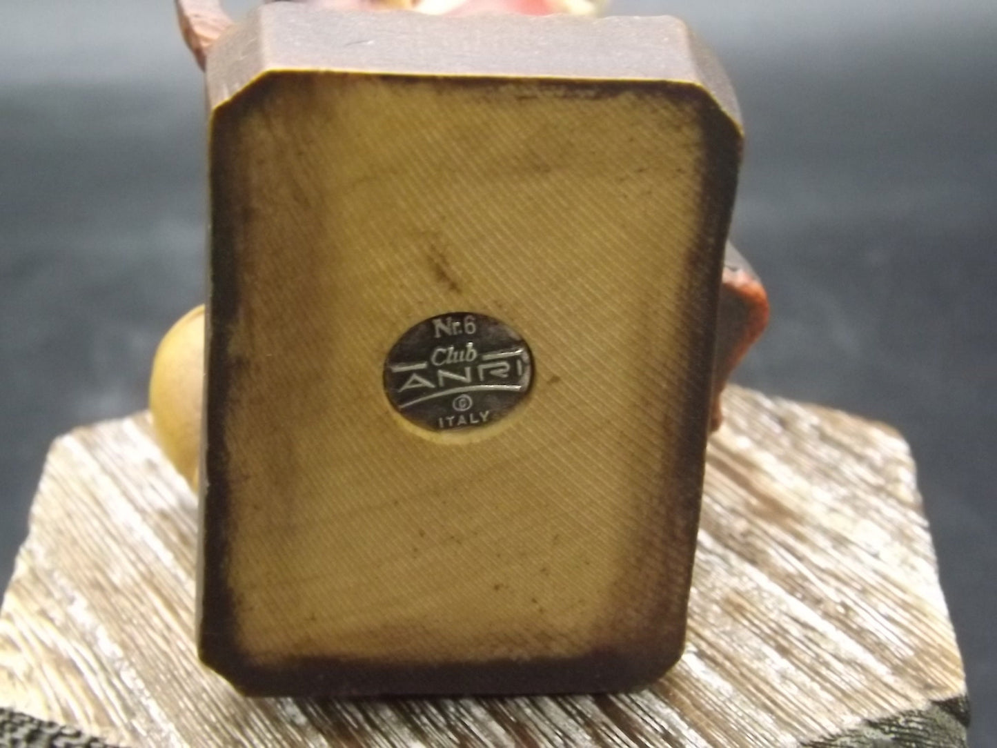 Vintage Anri "Harvest Help" carved wood figurine. Designed by Juan Ferrandiz. Young girl holding a bunch of grapes with her puppy.