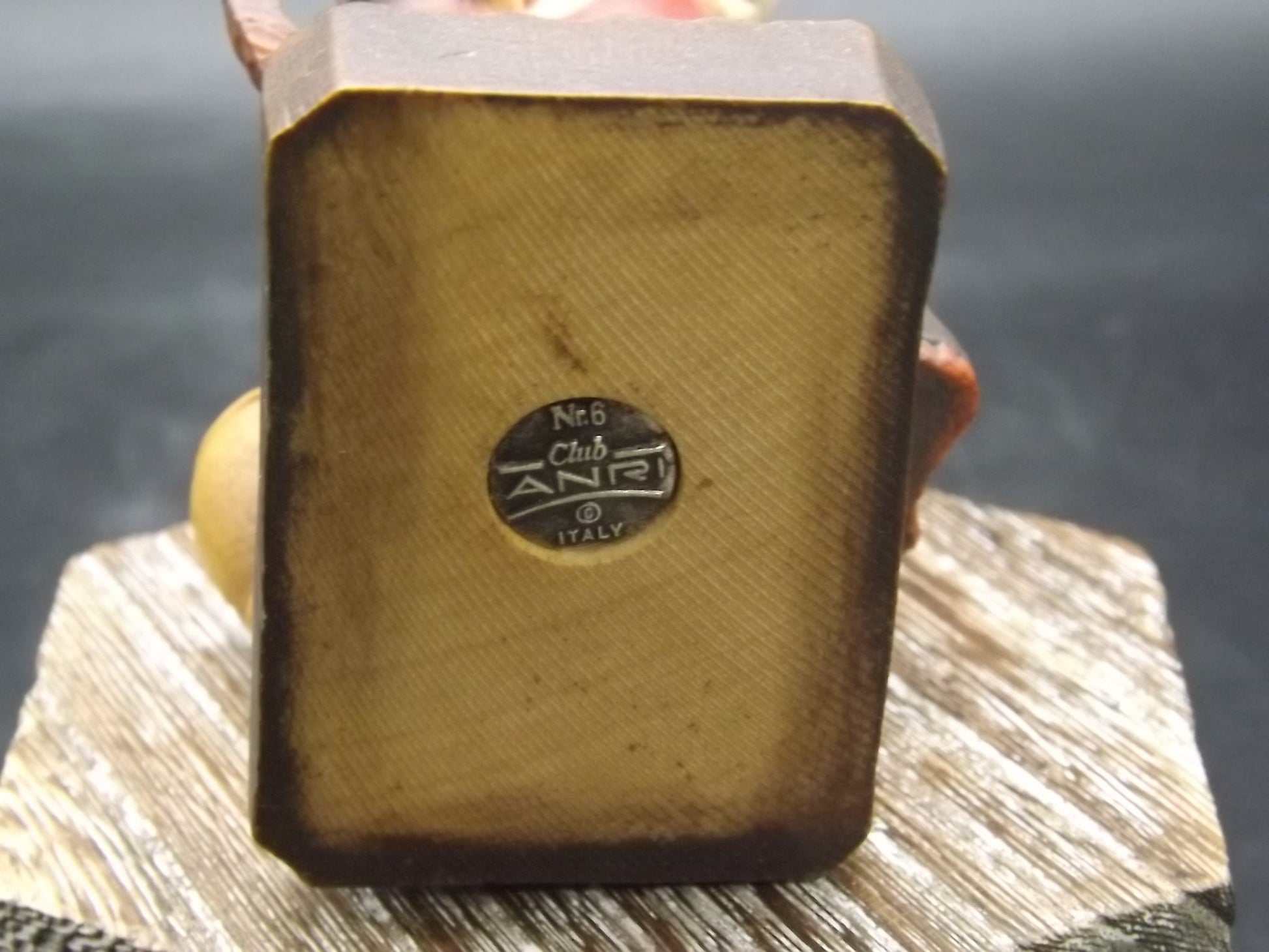 Vintage Anri "Harvest Help" carved wood figurine. Designed by Juan Ferrandiz. Young girl holding a bunch of grapes with her puppy.