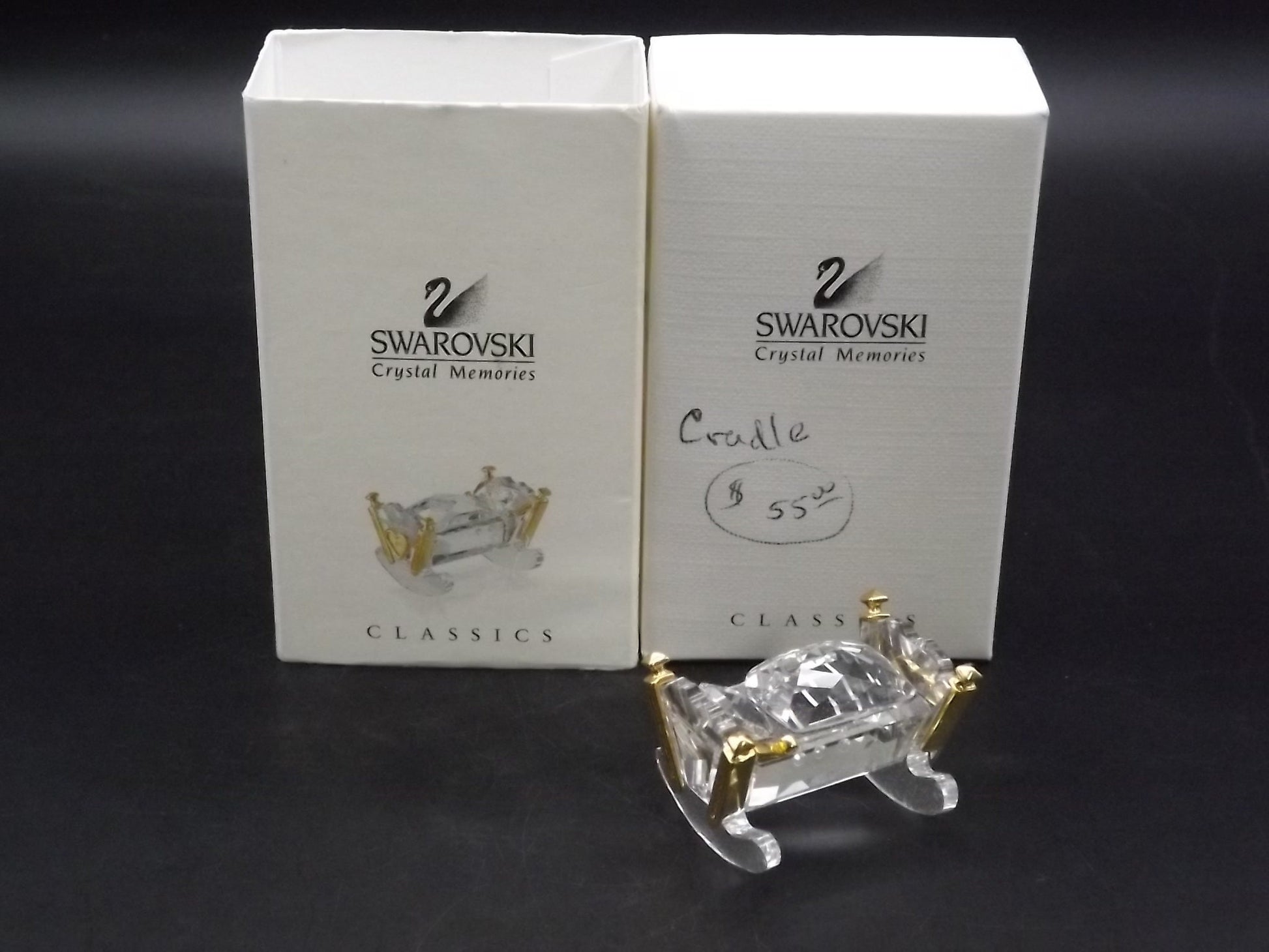 Vintage Swarovski Crystal Memories "Baby Crib Cradle" Figurine. Great Condition with original box. Very small chip as shown in photos.