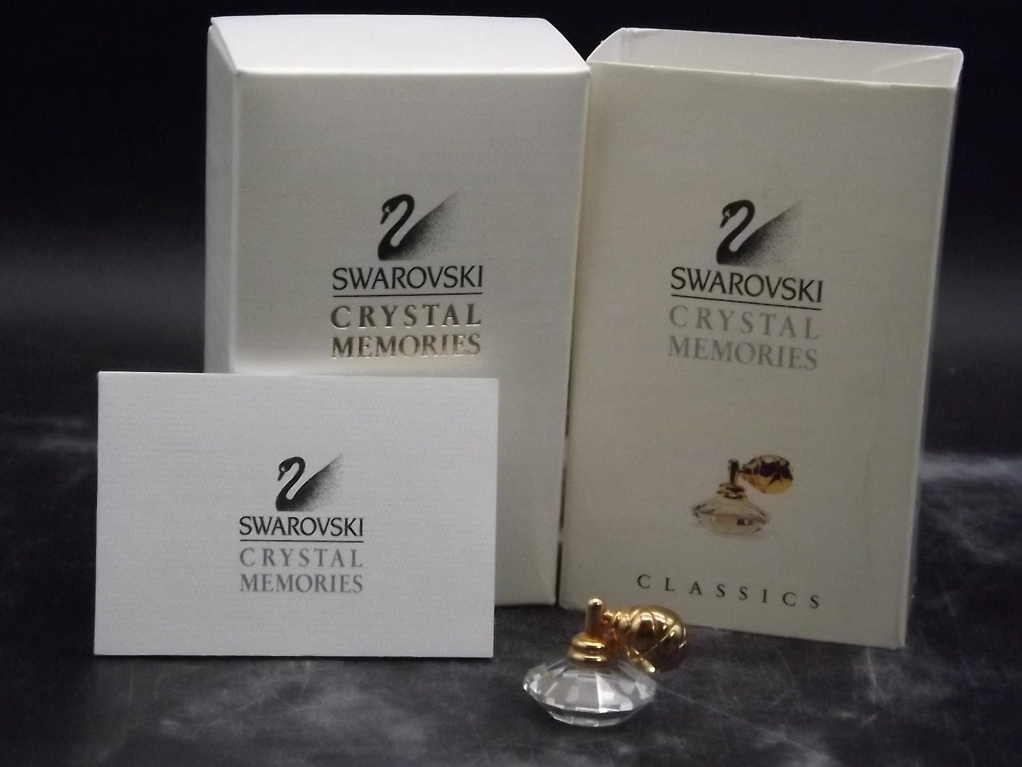 Vintage Swarovski Crystal Memories "Atomizer" Figurine. Excellent Condition with original box.