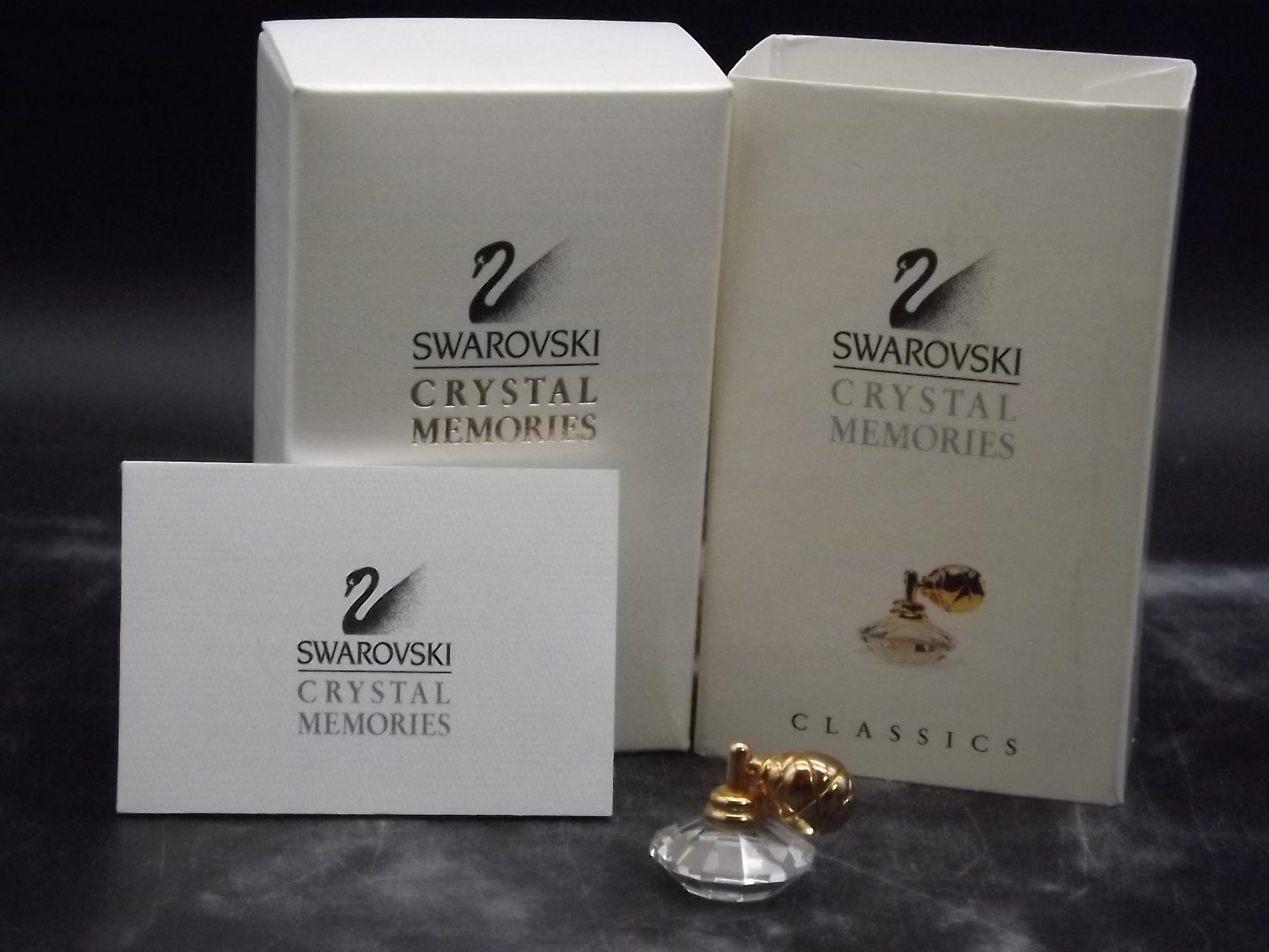 Vintage Swarovski Crystal Memories "Atomizer" Figurine. Excellent Condition with original box.