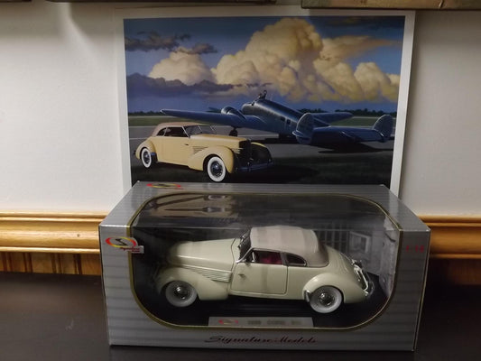 Vintage Signature Models 1936 Cord 810 Metal Model with original box and advertising poster. only opened take photos. Excellent condition.